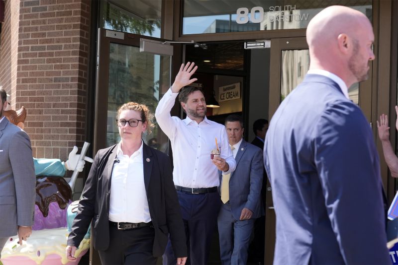 Republican vice presidential nominee Sen. JD Vance, R-Ohio, waves as he leaves with ice cream at Olson's Ice Cream Aug. 7, in Eau Claire, Wis.