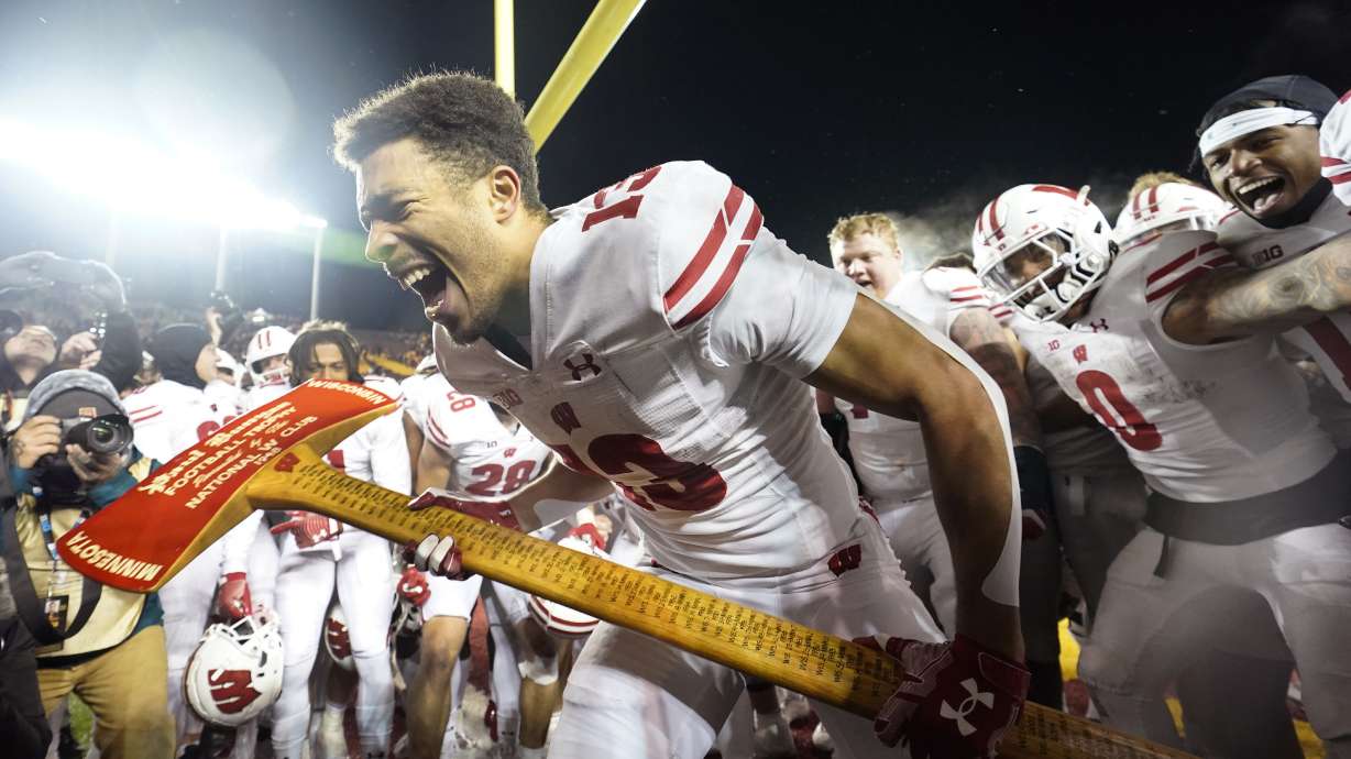 FILE - Wisconsin wide receiver Chimere Dike (13) celebrates after the 28-14 win against Minnesota of an NCAA college football game Saturday, Nov. 25, 2023, in Minneapolis.