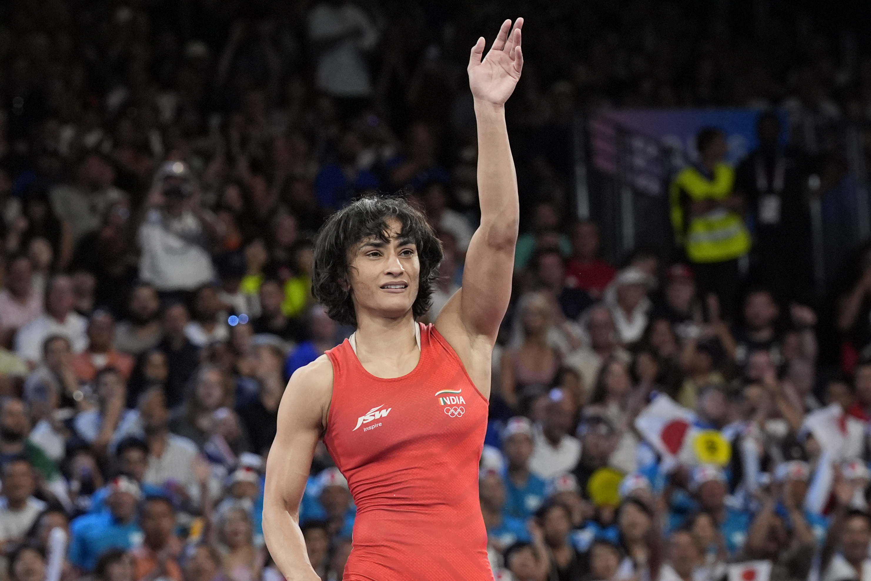 India's Vinesh Vinesh celebrates after defeating Cuba's Yusneylys Guzman during their women's freestyle 50kg wrestling semifinal match, at Champ-de-Mars Arena, during the 2024 Summer Olympics, Tuesday, Aug. 6, 2024, in Paris, France. 