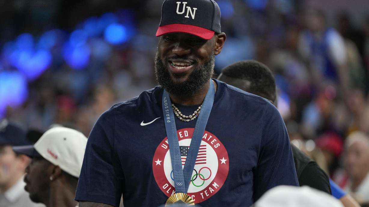 LeBron James wearing his gold medal is seen during a women's gold medal basketball game at Bercy Arena at the 2024 Summer Olympics, Sunday, Aug. 11, 2024, in Paris, France.