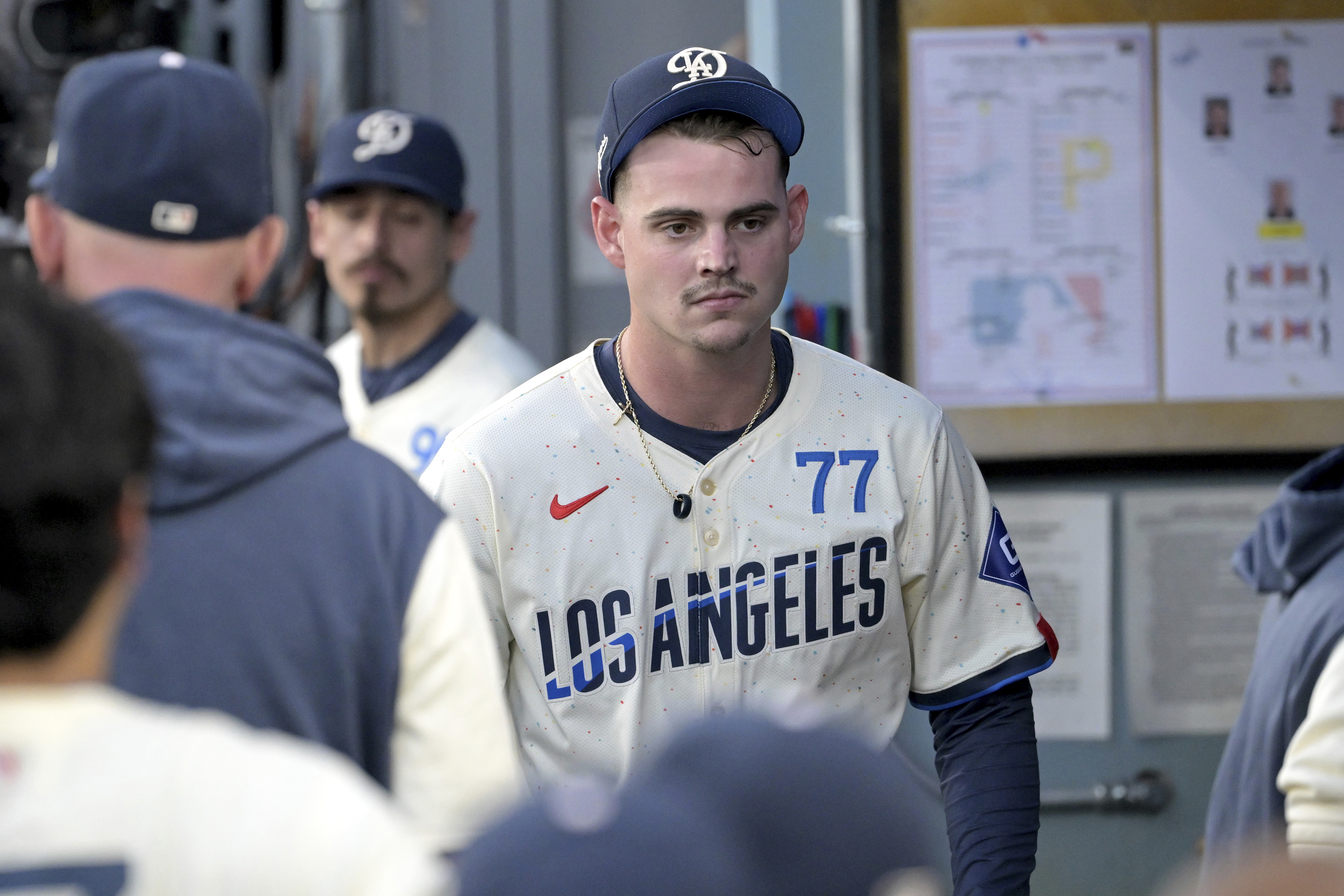 Los Angeles Dodgers starting pitcher River Ryan walks through the dugout as he leaves a baseball game with an injury during the fifth inning against the Pittsburgh Pirates, Saturday, Aug. 10, 2024, in Los Angeles. 