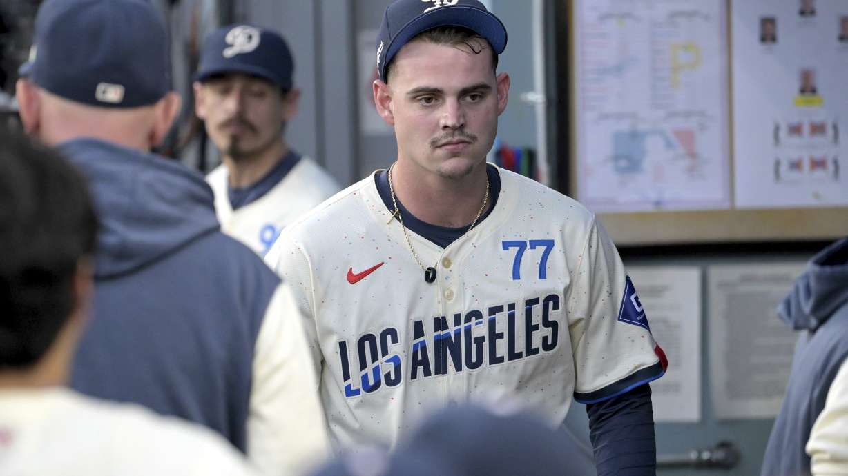 Los Angeles Dodgers starting pitcher River Ryan walks through the dugout as he leaves a baseball game with an injury during the fifth inning against the Pittsburgh Pirates, Saturday, Aug. 10, 2024, in Los Angeles.