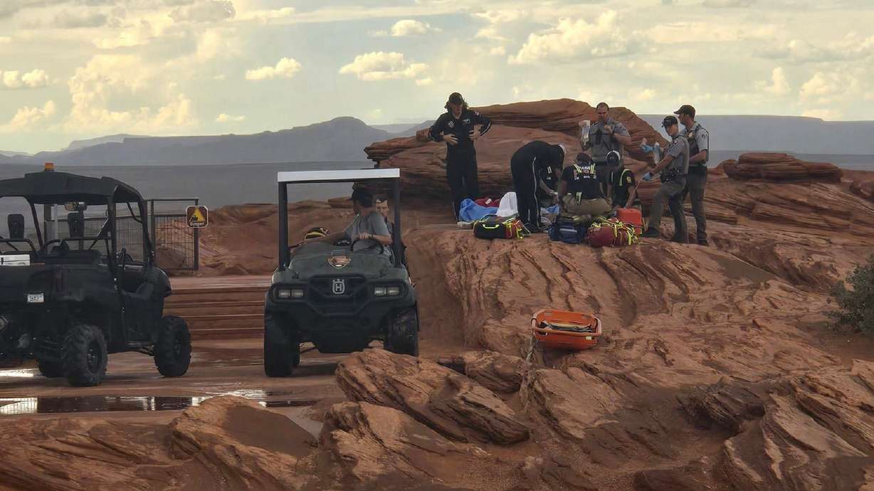 Paramedics treat two women who were injured by a lightning strike at Horseshoe Bend on the Arizona side of Glen Canyon National Recreation Area Monday afternoon. Both women were transportation to St. George Regional Hospital.