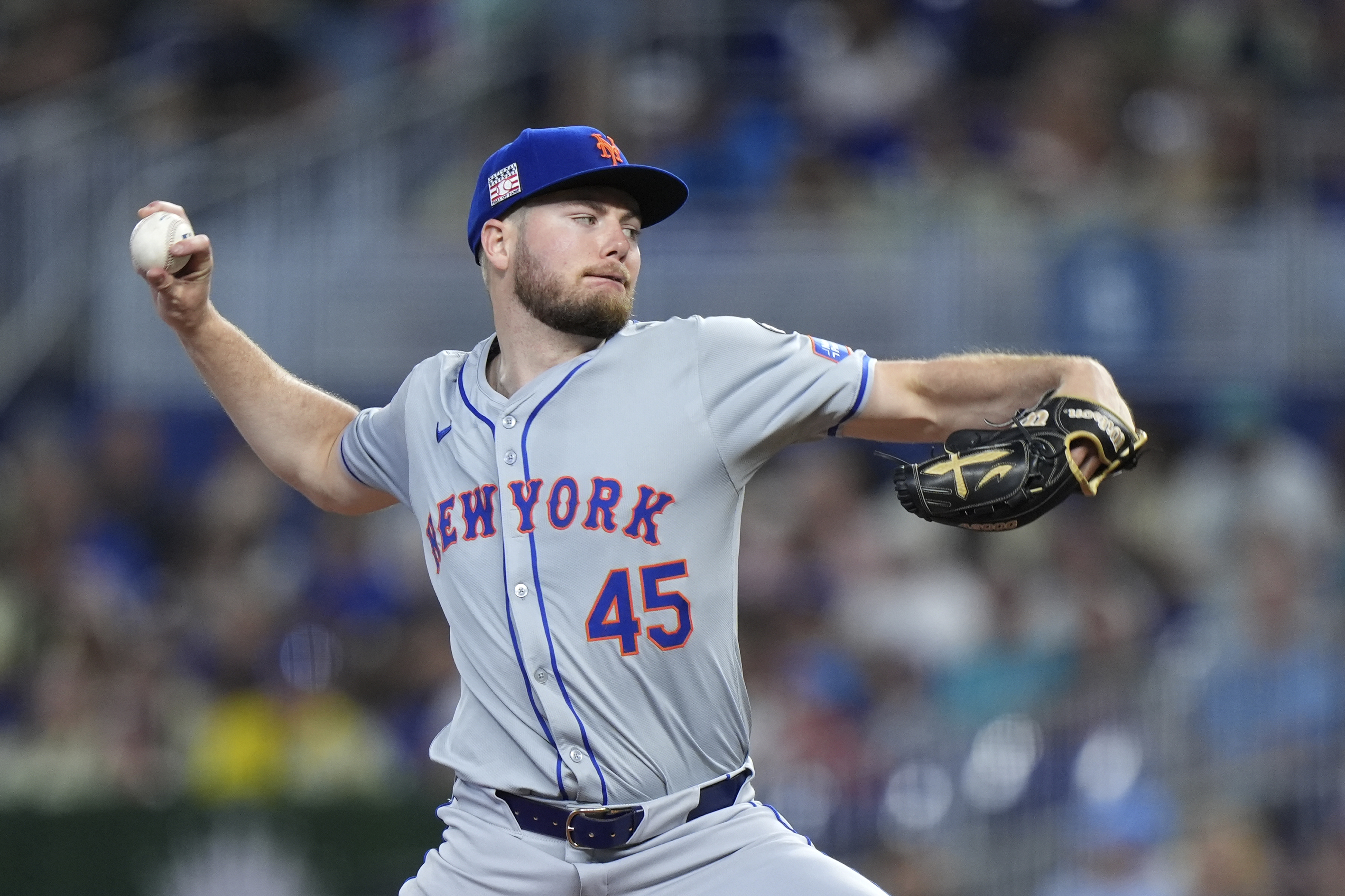 New York Mets' Christian Scott delivers a pitch during the first inning of a baseball game against the Miami Marlins, Sunday, July 21, 2024, in Miami. 