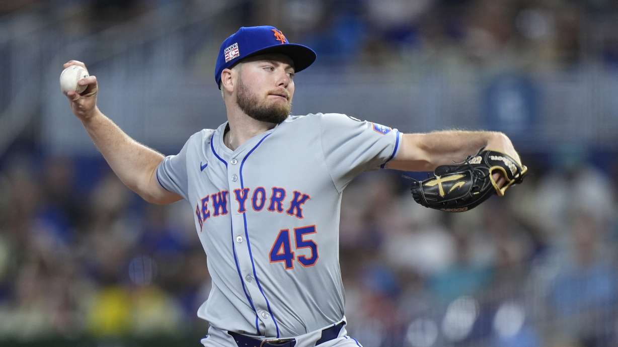 New York Mets' Christian Scott delivers a pitch during the first inning of a baseball game against the Miami Marlins, Sunday, July 21, 2024, in Miami.