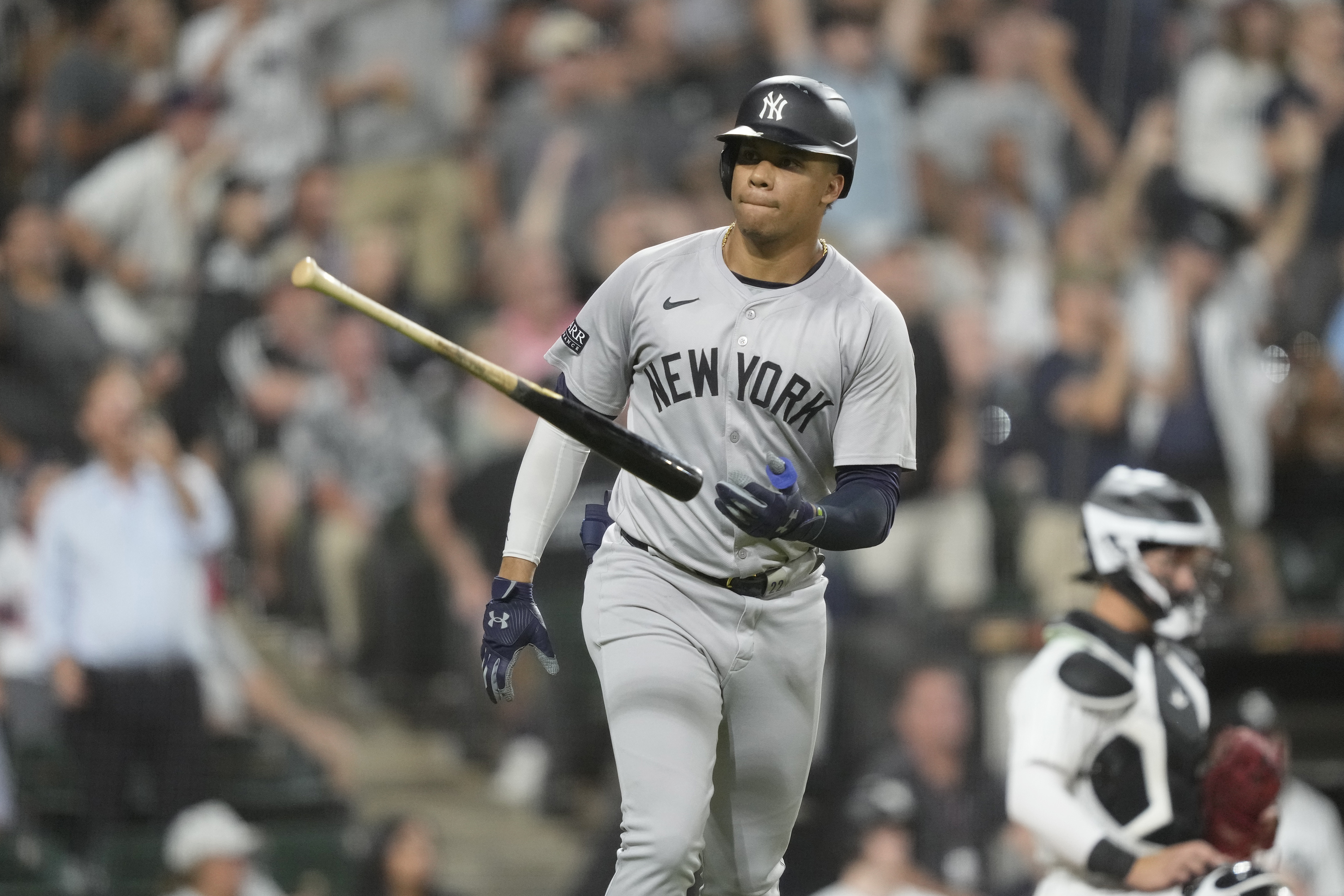 New York Yankees' Juan Soto tosses his bat after hitting a home run off Chicago White Sox relief pitcher Fraser Ellard, Soto's third of the game, during the seventh inning of a baseball game Tuesday, Aug. 13, 2024, in Chicago. 