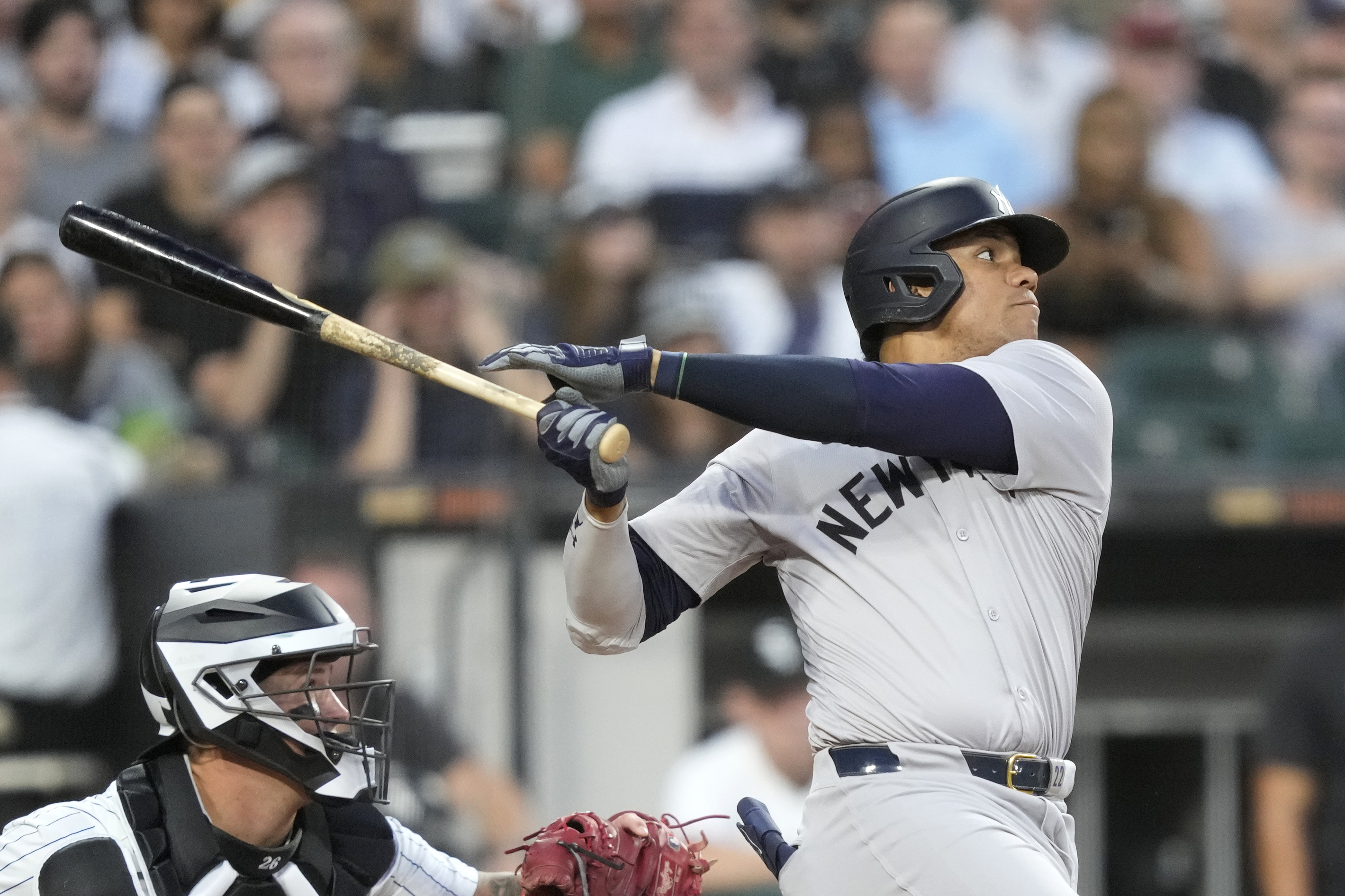 New York Yankees' Juan Soto watches his two-run home run off Chicago White Sox starting pitcher Jonathan Cannon during the third inning of a baseball game Tuesday, Aug. 13, 2024, in Chicago. 