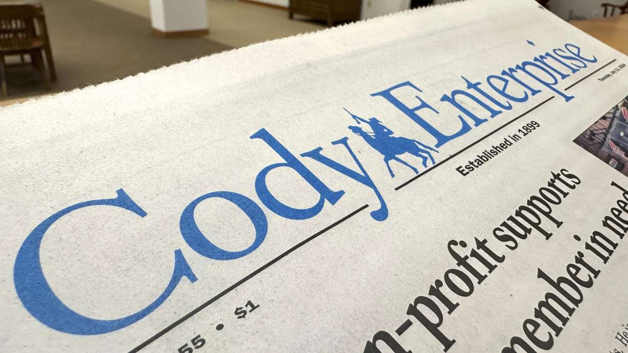 A recent issue of the Cody Enterprise, the Wyoming newspaper where a reporter used artificial intelligence to help write his stories, is seen Tuesday at the Wyoming State Library in Cheyenne.