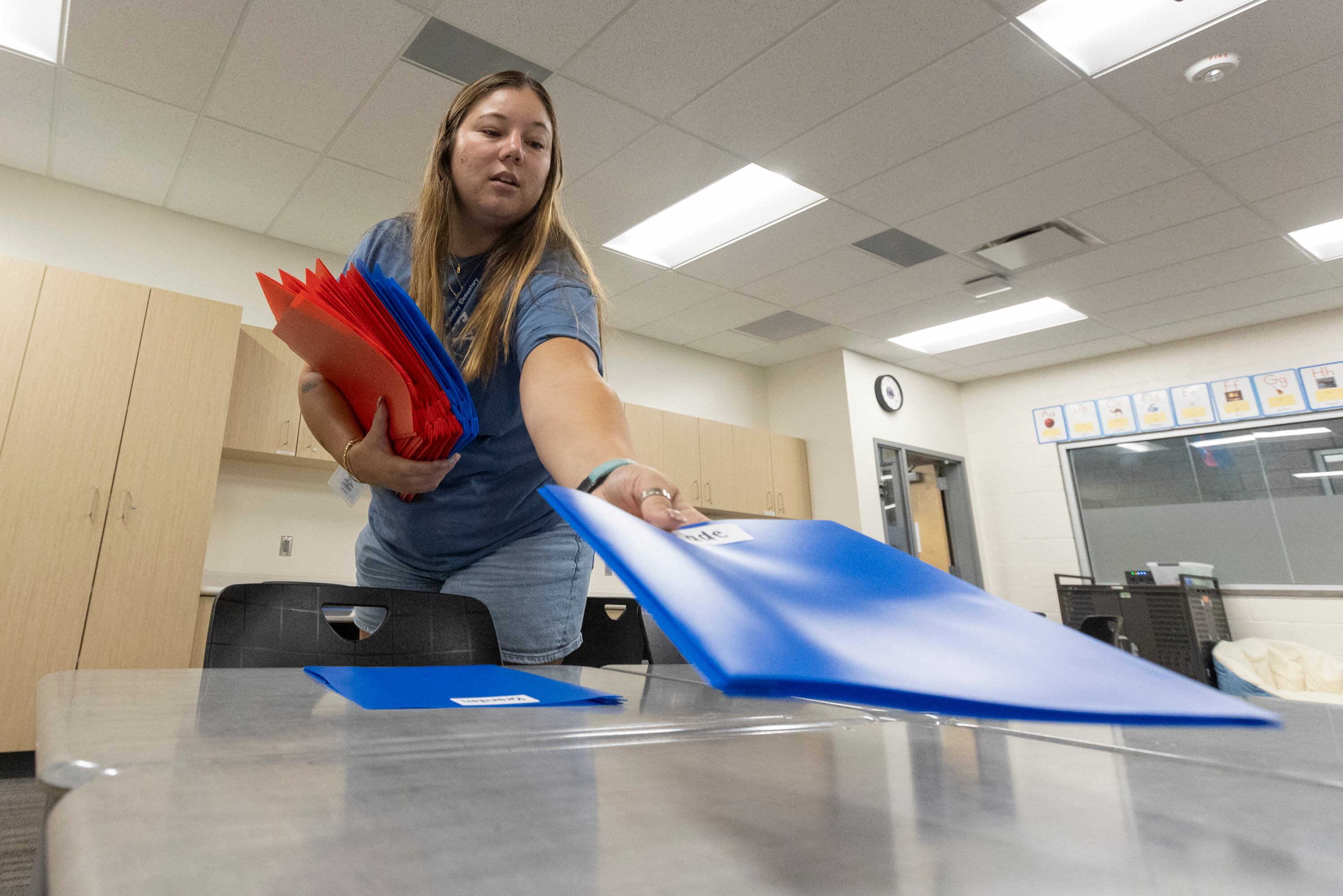 Fifth grade teacher Destiny Bruening prepares her classroom for the first day of school at Midvalley Elementary School in Midvale on Monday.