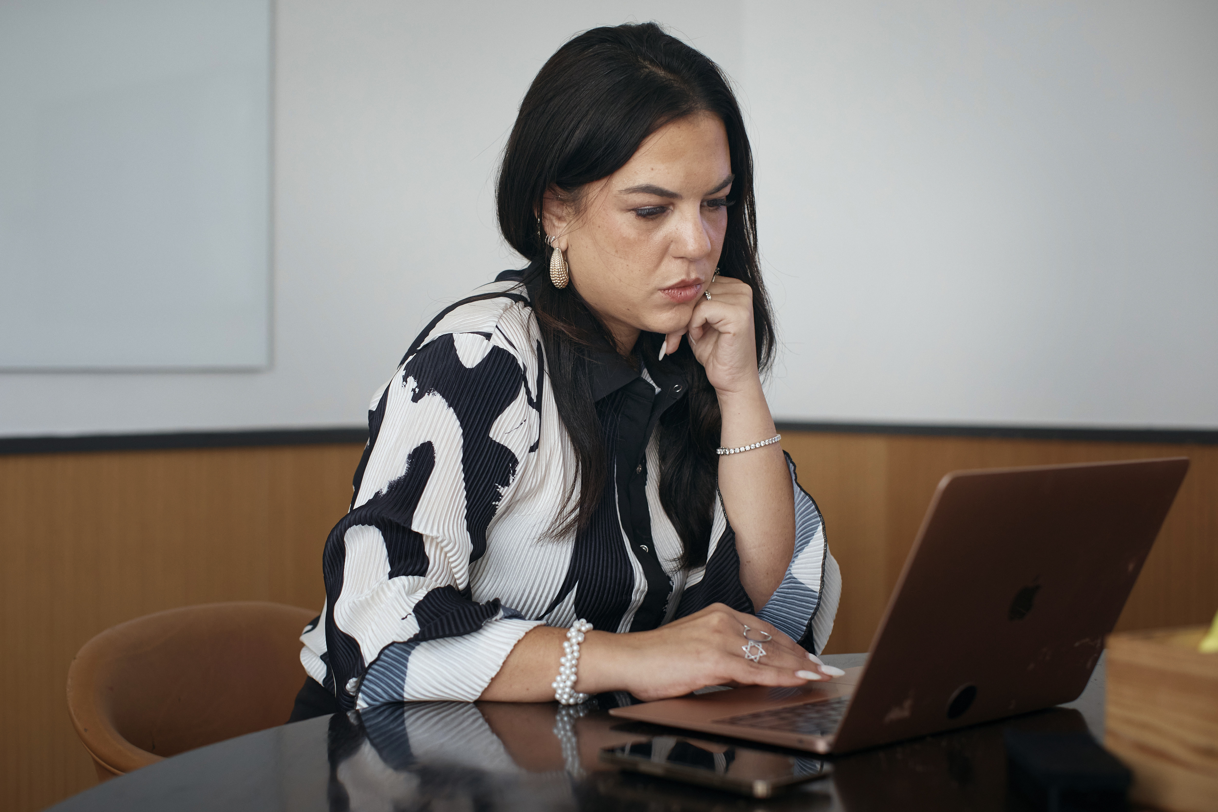 Becky Litvintchouk works on her computer on Aug. 12 in New York. People who have ADHD are starting to turn to AI to help them break down once-insurmountable tasks like emails, business plans and proofreading. 