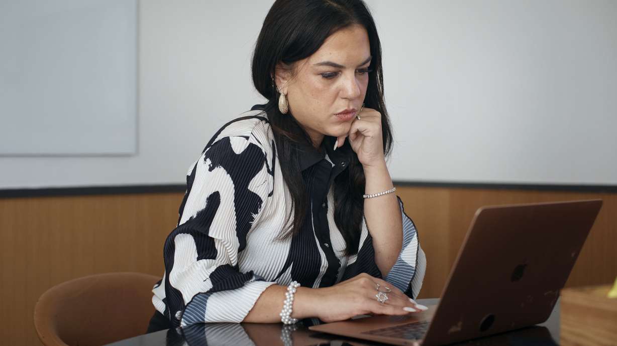 Becky Litvintchouk works on her computer on Aug. 12 in New York. People who have ADHD are starting to turn to AI to help them break down once-insurmountable tasks like emails, business plans and proofreading.