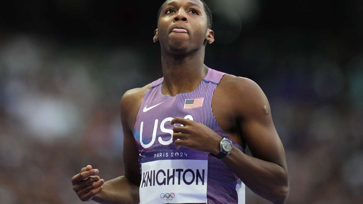 Erriyon Knighton, of the United States, reacts following his men's 200-meter semifinal at the 2024 Summer Olympics, Wednesday, Aug. 7, 2024, in Saint-Denis, France.