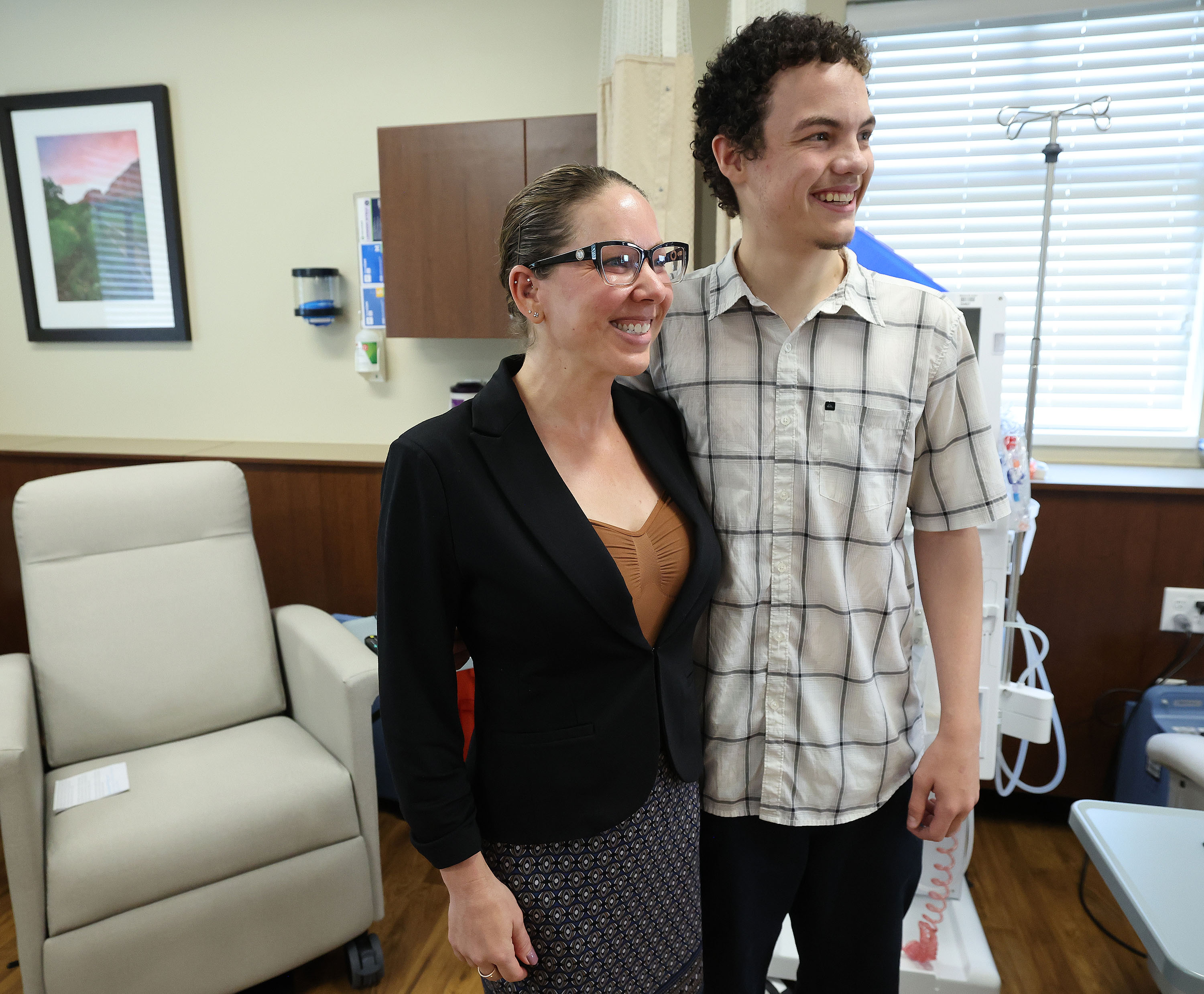 Kidney recipient Henry Coulter stands with his donor Monica Leger during an interview in Richfield on Tuesday. The Utah teen is heading back to school and sports after a rare second kidney transplant.