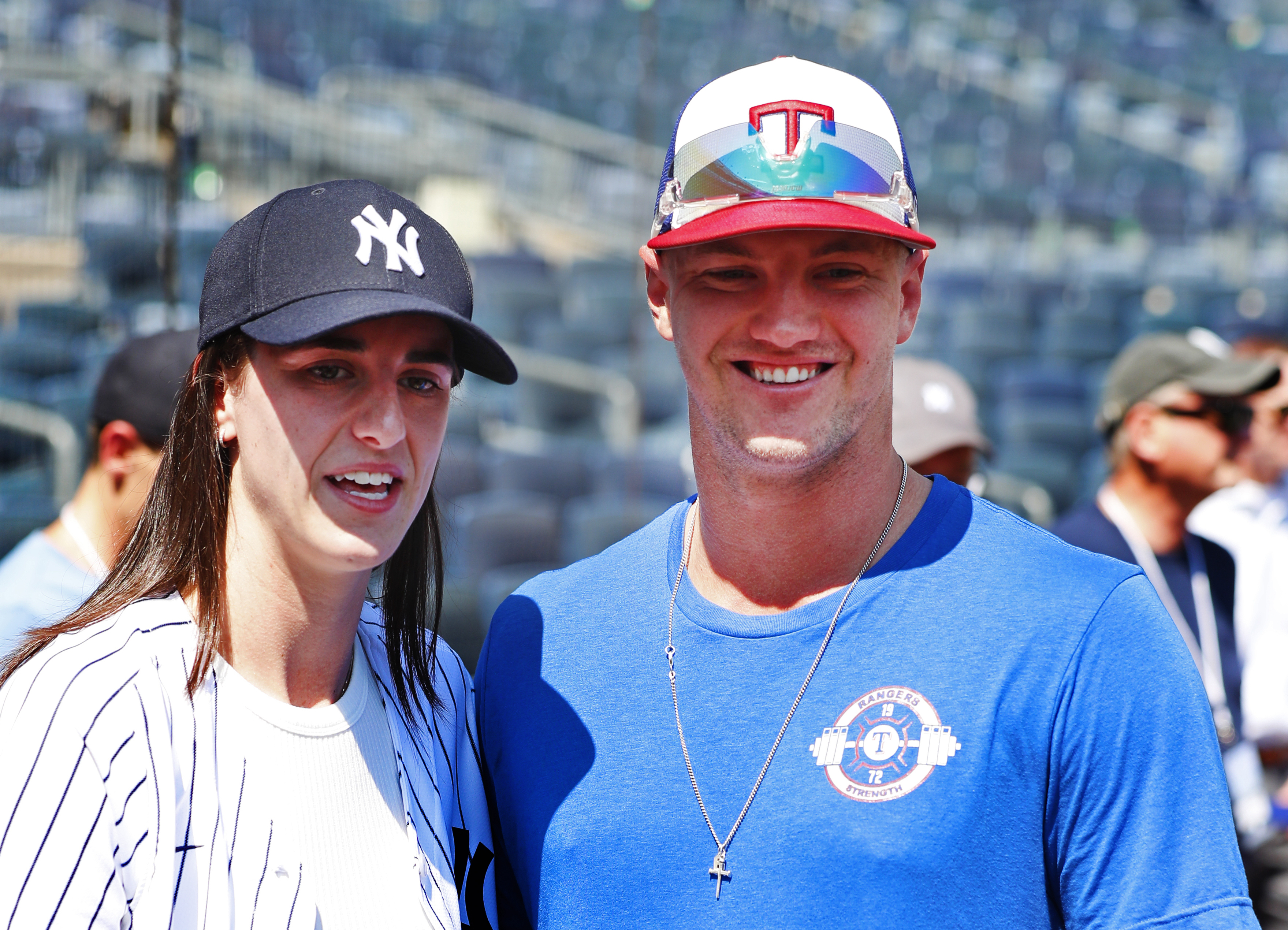 WNBA basketball player Caitlin Clark and Texas Rangers Josh Jung are photographed before a baseball double header game between the New York Yankees and the Texas Rangers, Saturday, Aug. 10, 2024 in New York.