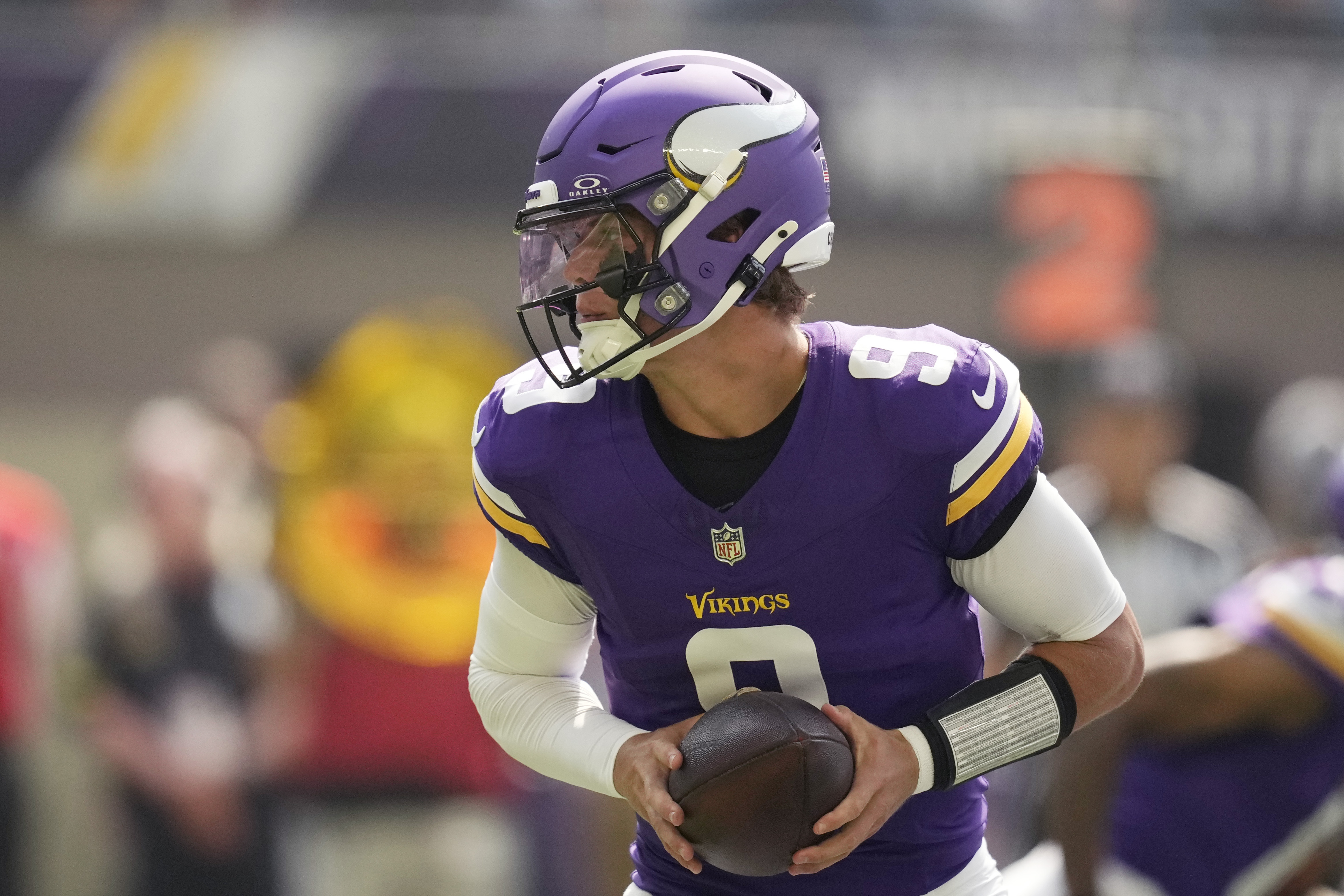 Minnesota Vikings quarterback J.J. McCarthy (9) looks to hand off during the first half of an NFL football game against the Las Vegas Raiders, Saturday, Aug. 10, 2024, in Minneapolis. 