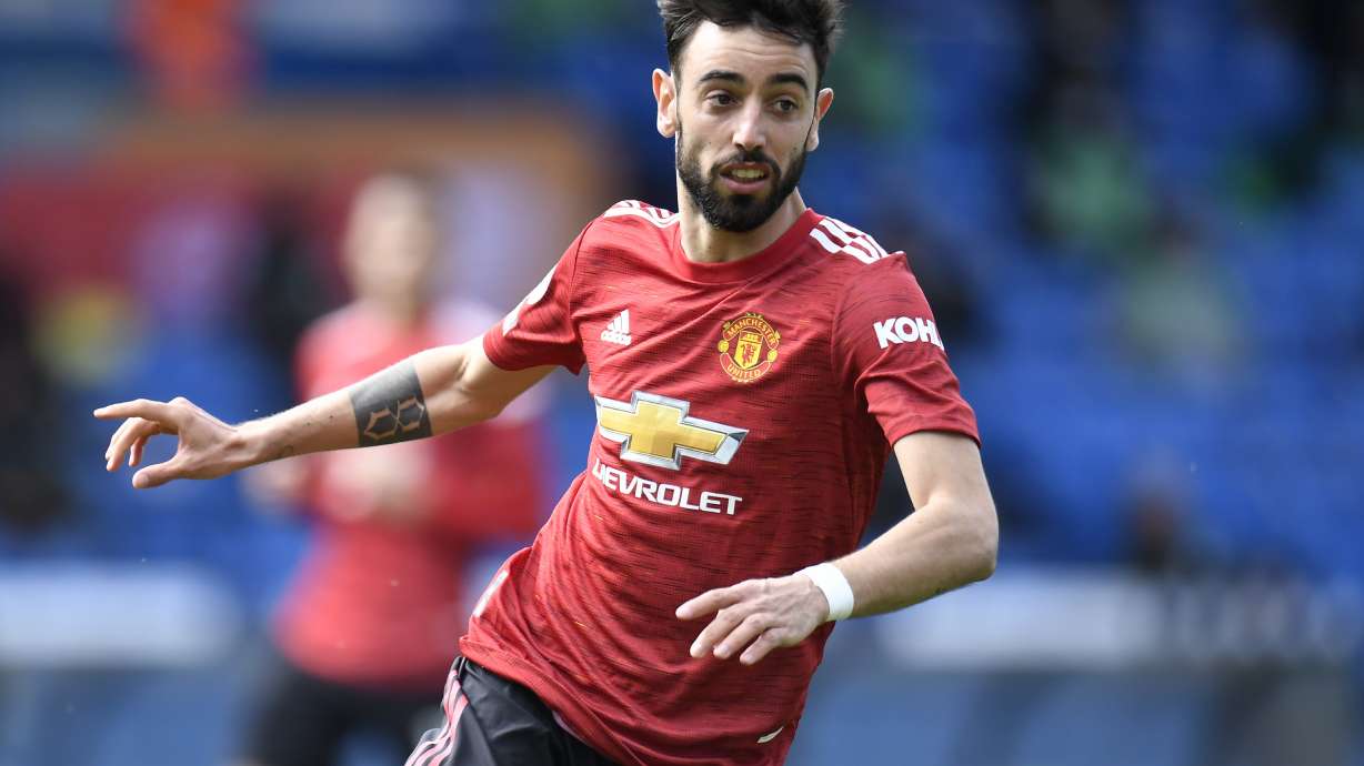 FILE - Manchester United's Bruno Fernandes in action during an English Premier League soccer match at Elland Road in Leeds, England, on April 25, 2021.