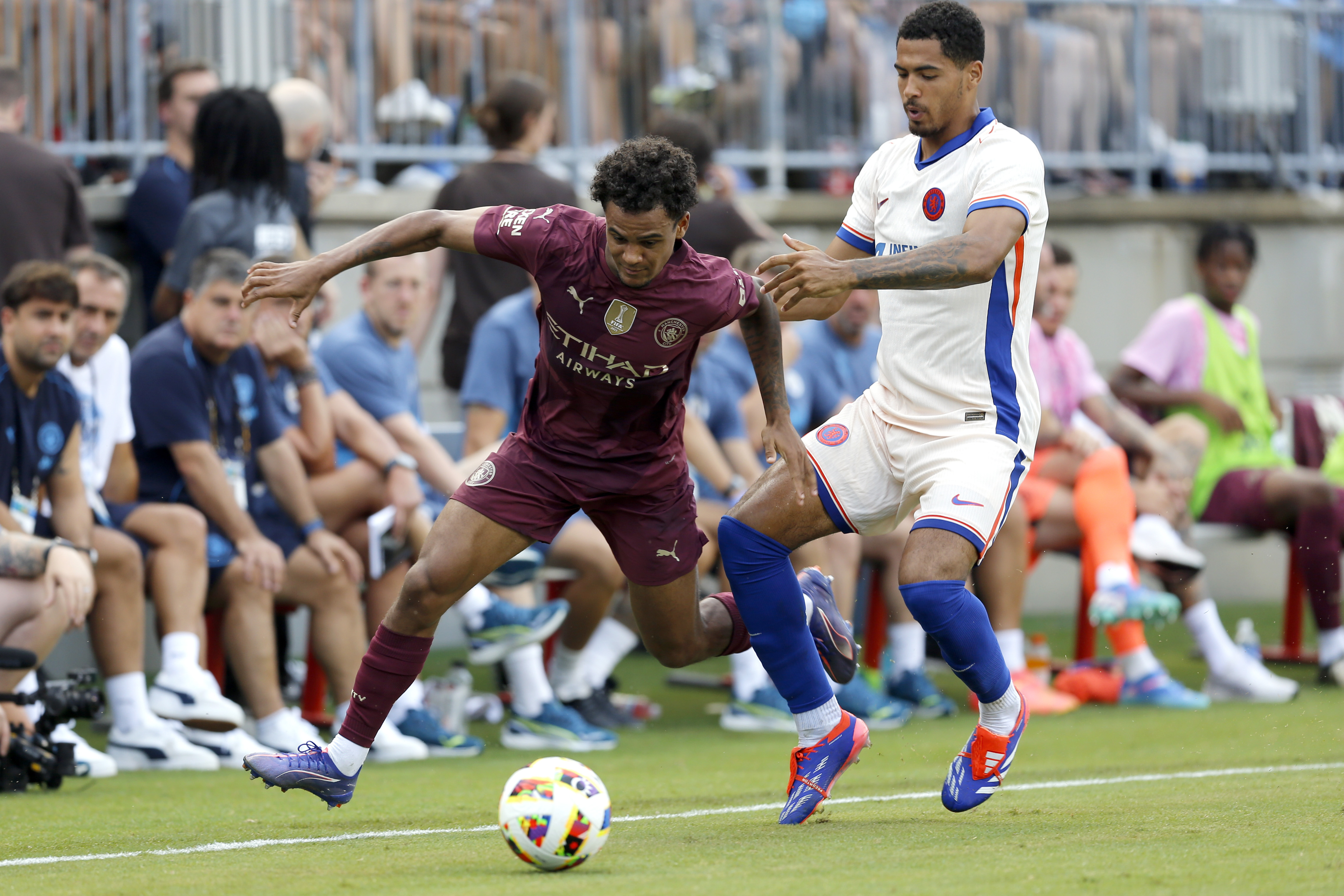 Manchester City's Oscar Bobb, left, works the ball past Chelsea's Levi Colwill, right, during an FC Series soccer match, Saturday, Aug. 3, 2024, at Ohio Stadium in Columbus, Ohio. 