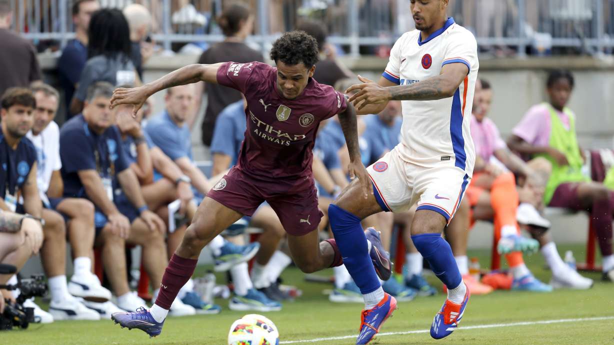Manchester City's Oscar Bobb, left, works the ball past Chelsea's Levi Colwill, right, during an FC Series soccer match, Saturday, Aug. 3, 2024, at Ohio Stadium in Columbus, Ohio.