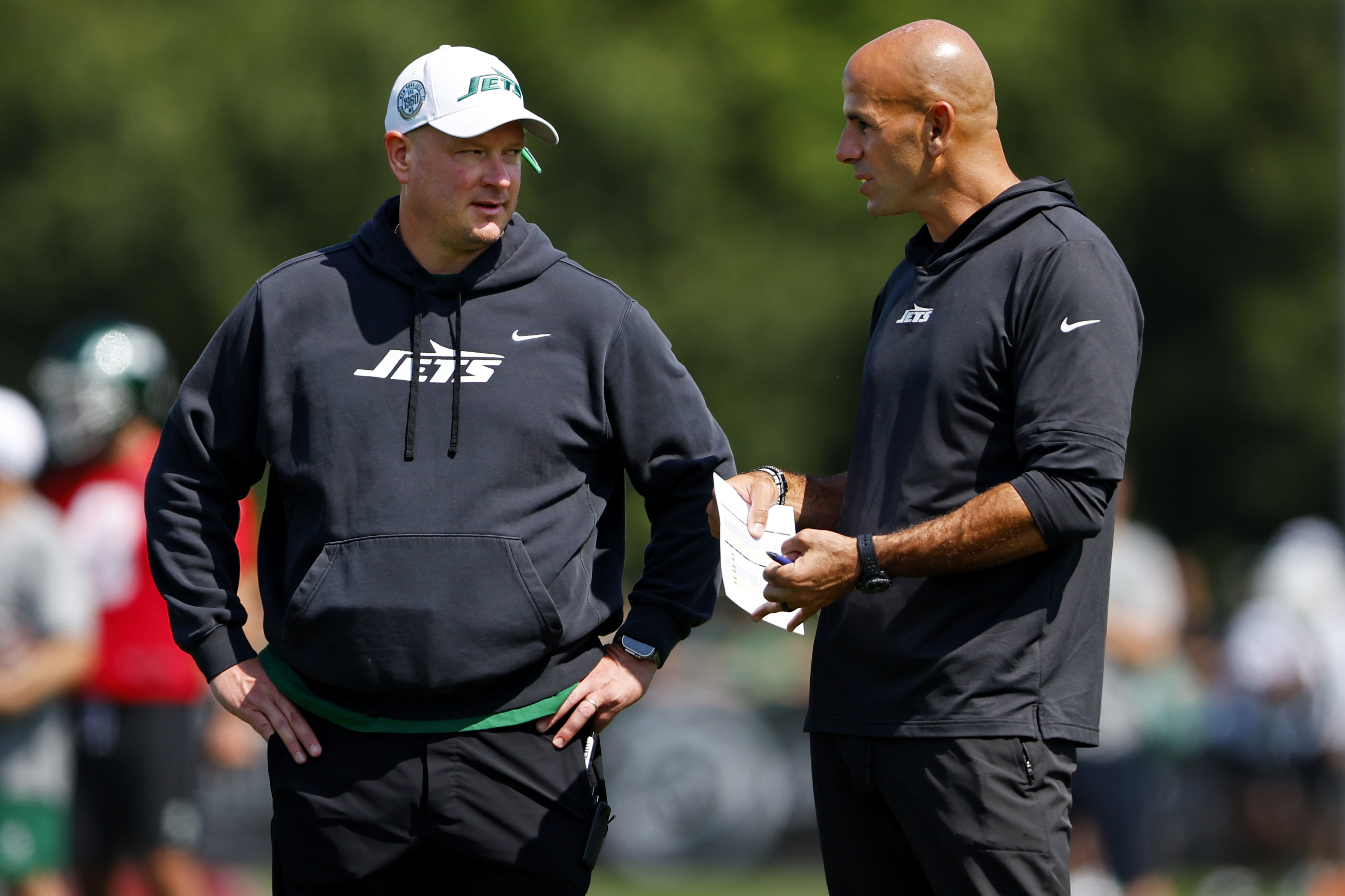 New York Jets offensive coordinator Nathaniel Hackett talks wit head coach Robert Saleh during the team's NFL football training camp, Saturday, July 27, 2024, in Florham Park, N.J. 