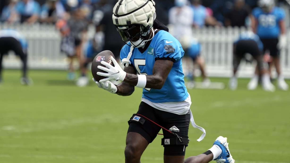 Carolina Panthers wide receiver Diontae Johnson (5) catches a pass during the NFL football team's training camp in Charlotte, N.C., Saturday, Aug. 3, 2024.