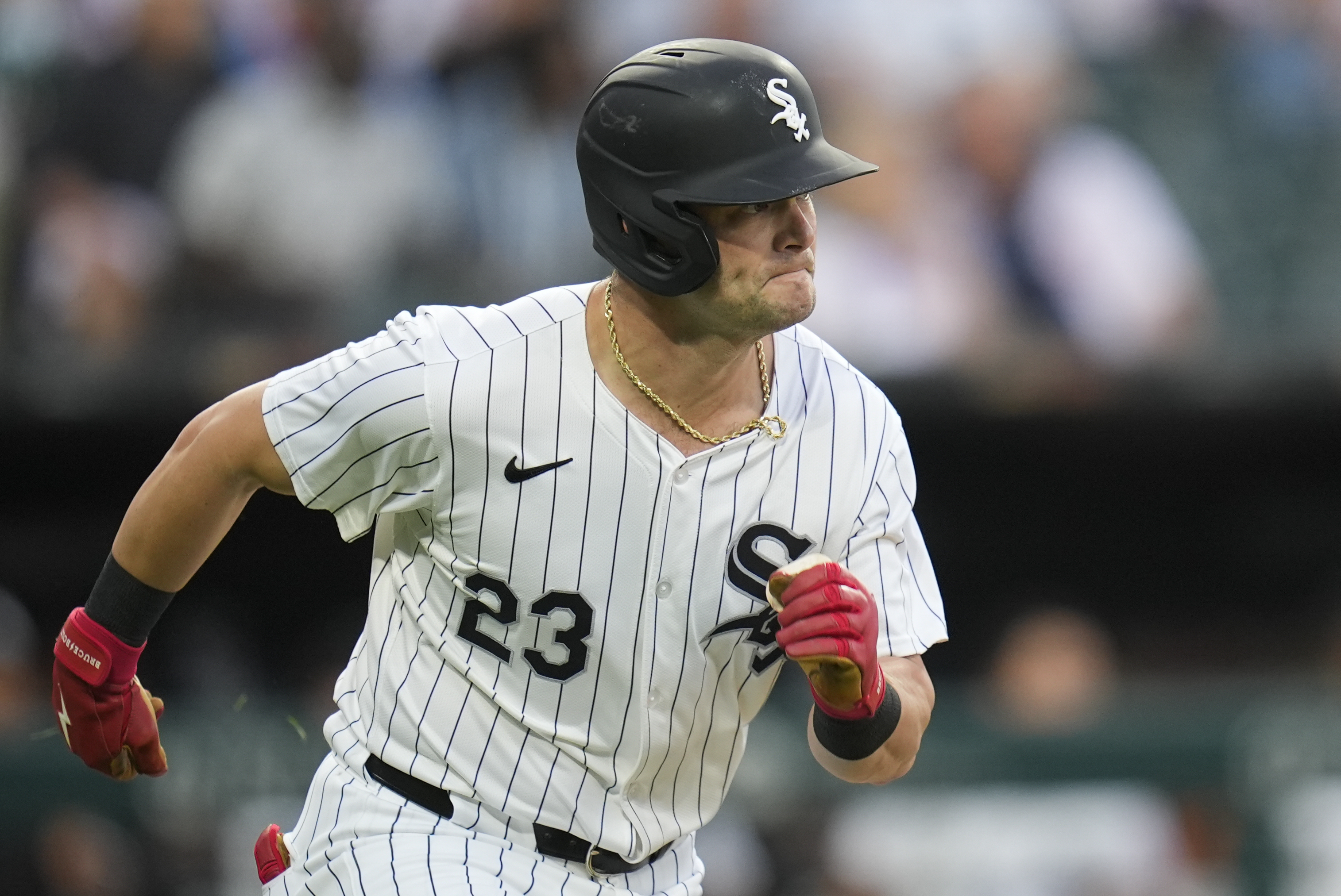Chicago White Sox's Andrew Benintendi runs the bases for a double, his 1,000th MLB career hit, during the first inning of a baseball game against the New York Yankees, Wednesday, Aug. 14, 2024, in Chicago. 
