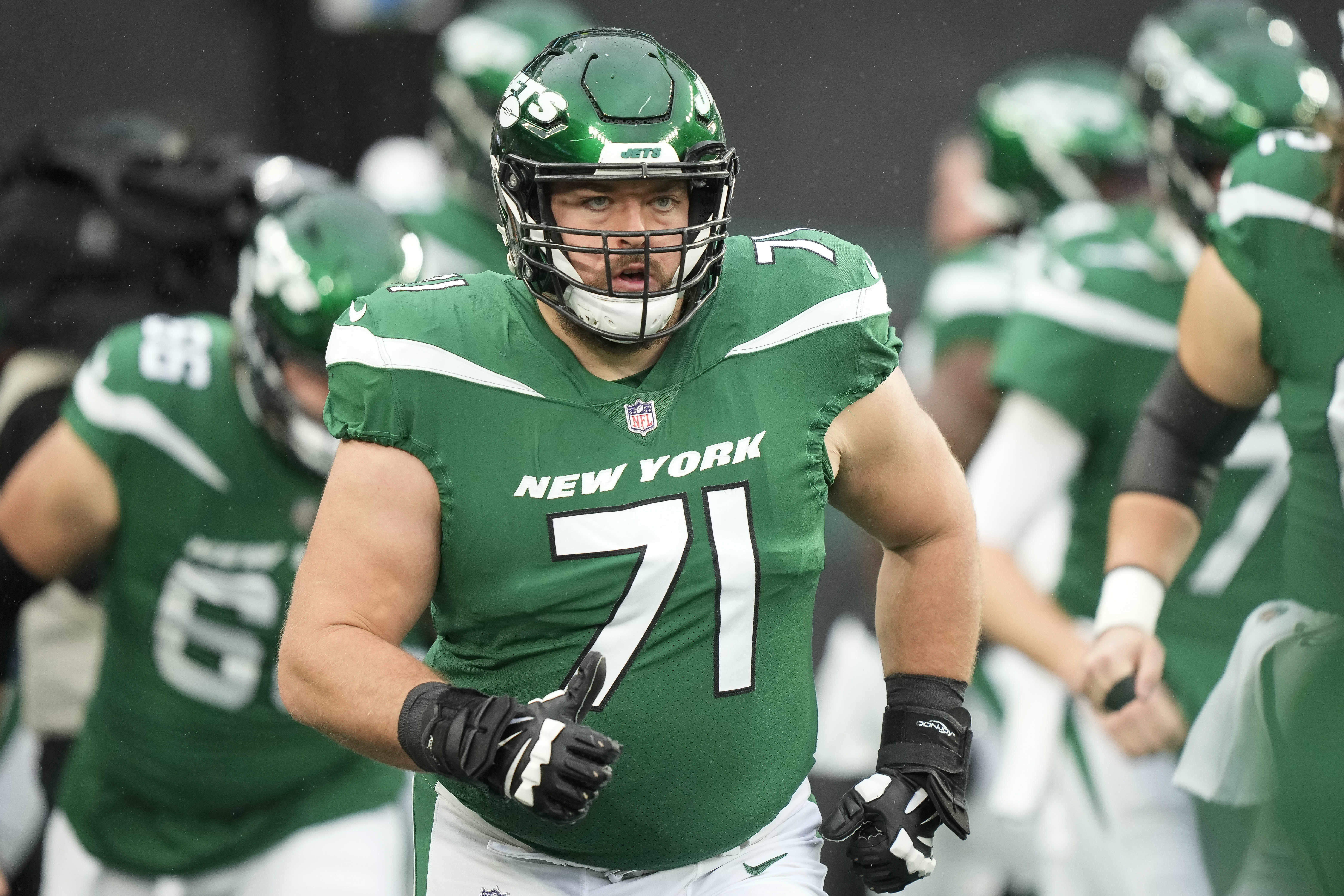 FILE- New York Jets offensive guard Wes Schweitzer (71) warms up before an NFL football game against the Atlanta Falcons on Sunday, Dec. 3, 2023, in East Rutherford, N.J. 