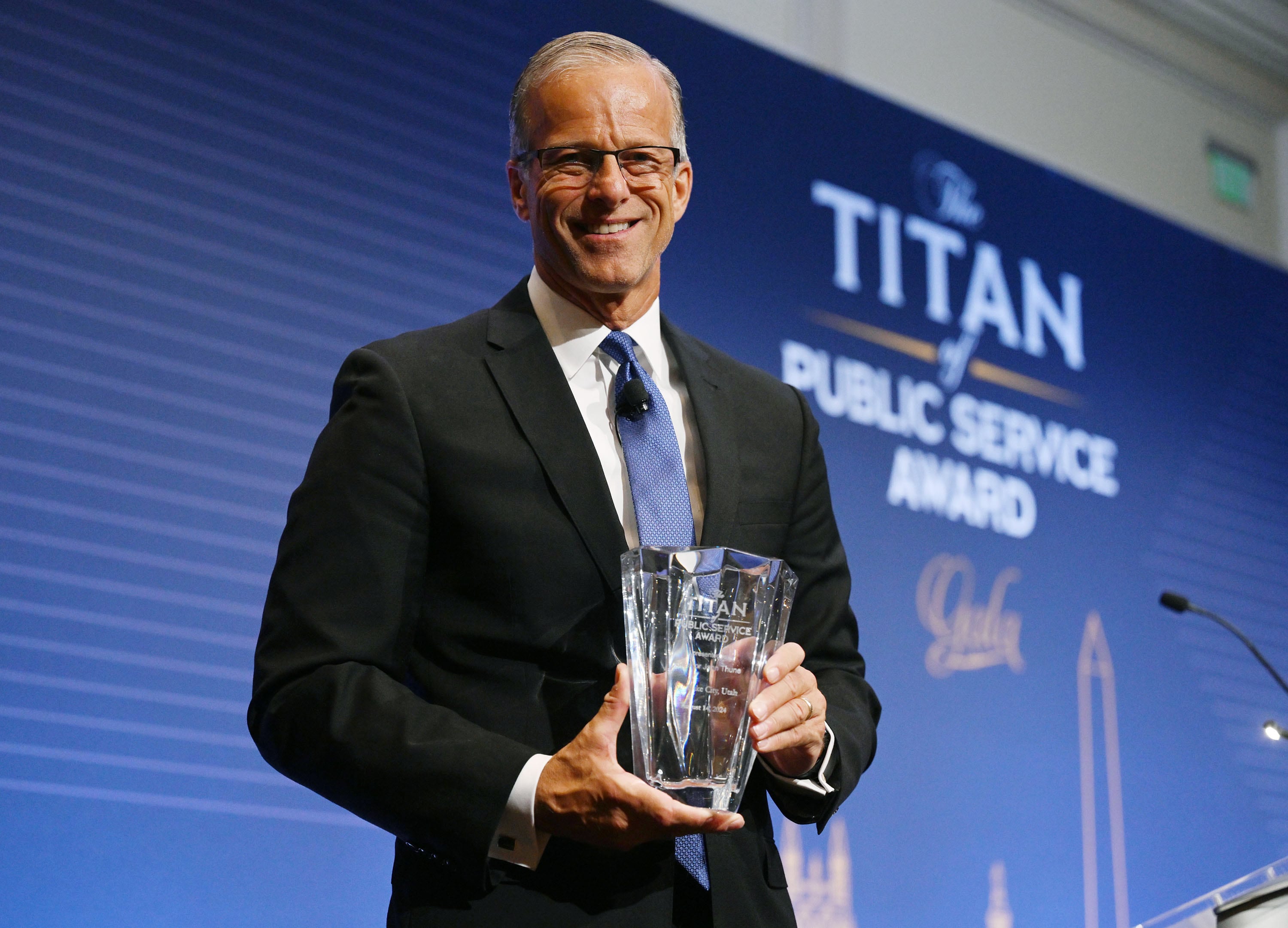 Senate Republican Whip John Thune, R-S.D., poses for a photo after receiving the Titan of Public Service Award during a special gala event of the Orrin G. Hatch Foundation at Salt Lake City's Grand America on Wednesday.