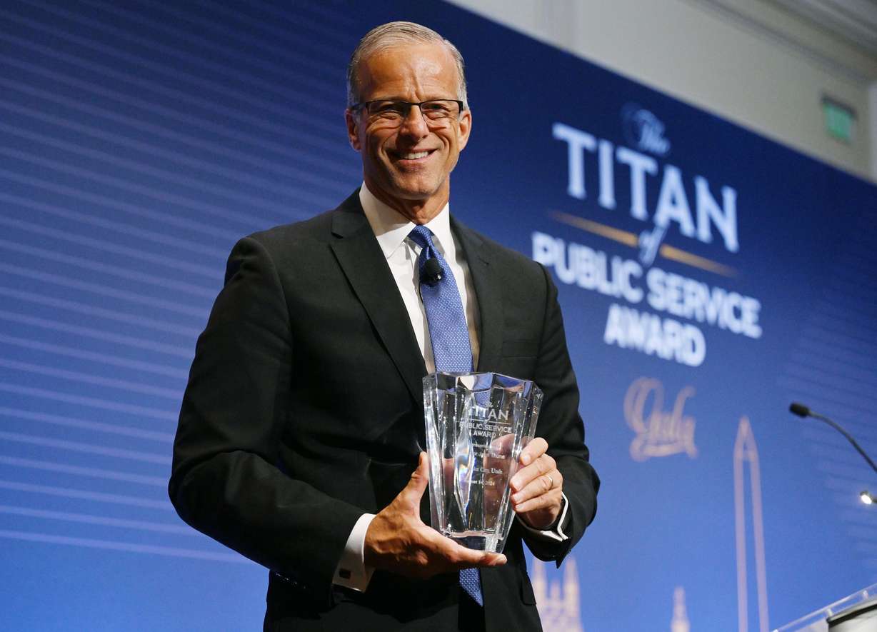 Senate Republican Whip John Thune, R-S.D., poses for a photo after receiving the Titan of Public Service Award during a special gala event of the Orrin G. Hatch Foundation at Salt Lake City's Grand America on Wednesday.