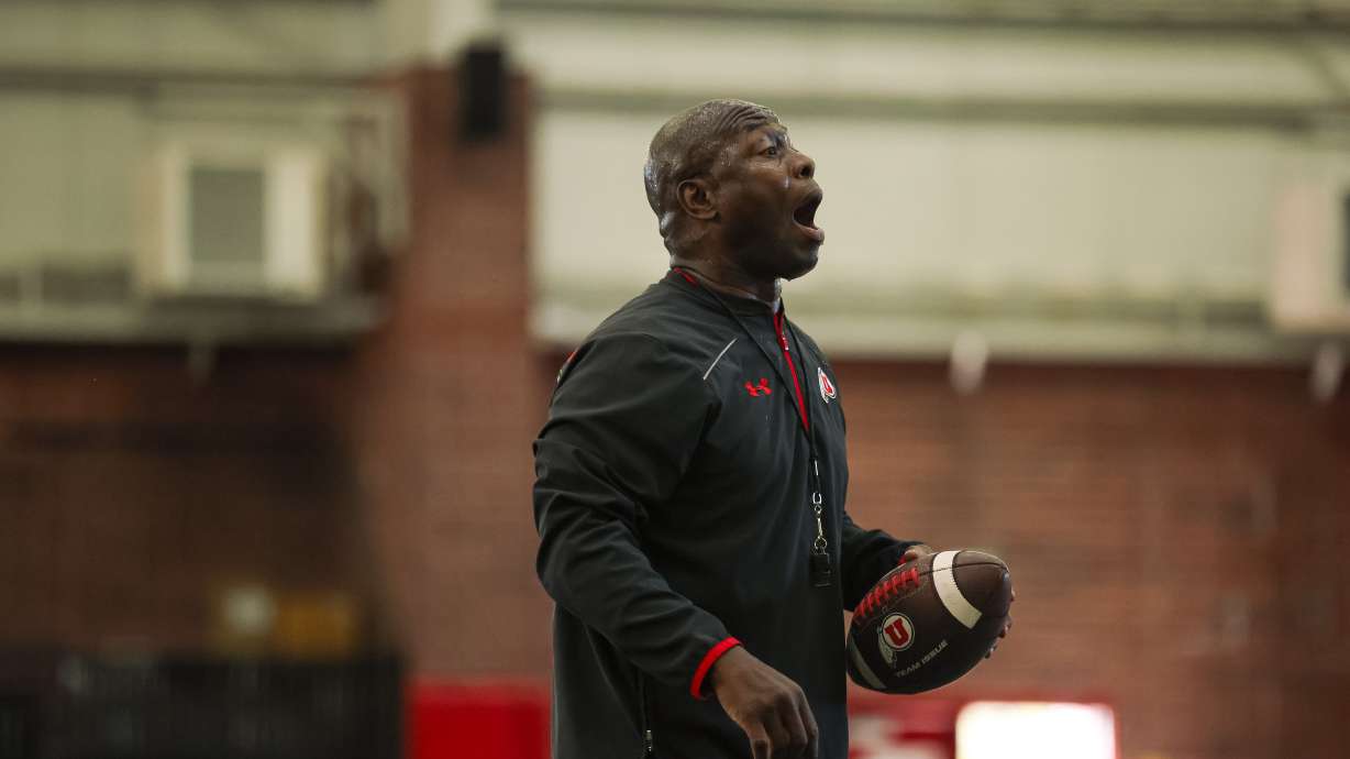 Cornerbacks coach Sharreiff Shah works with his players during drills as part of Utah's fall camp on July 29, 2024.