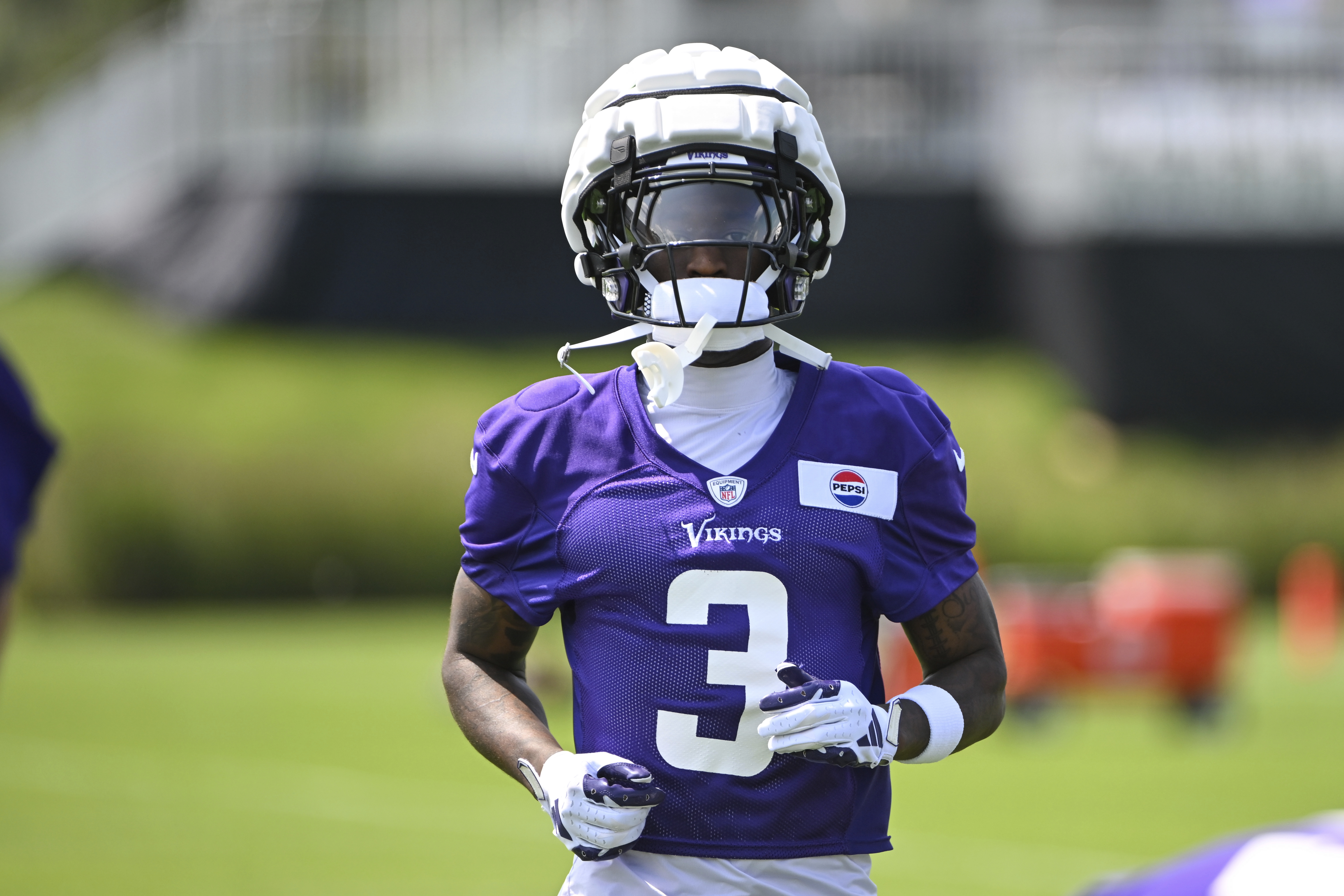 Minnesota Vikings wide receiver Jordan Addison warms up during NFL football training camp in Eagan, Minn., Wednesday, July 24, 2024. 