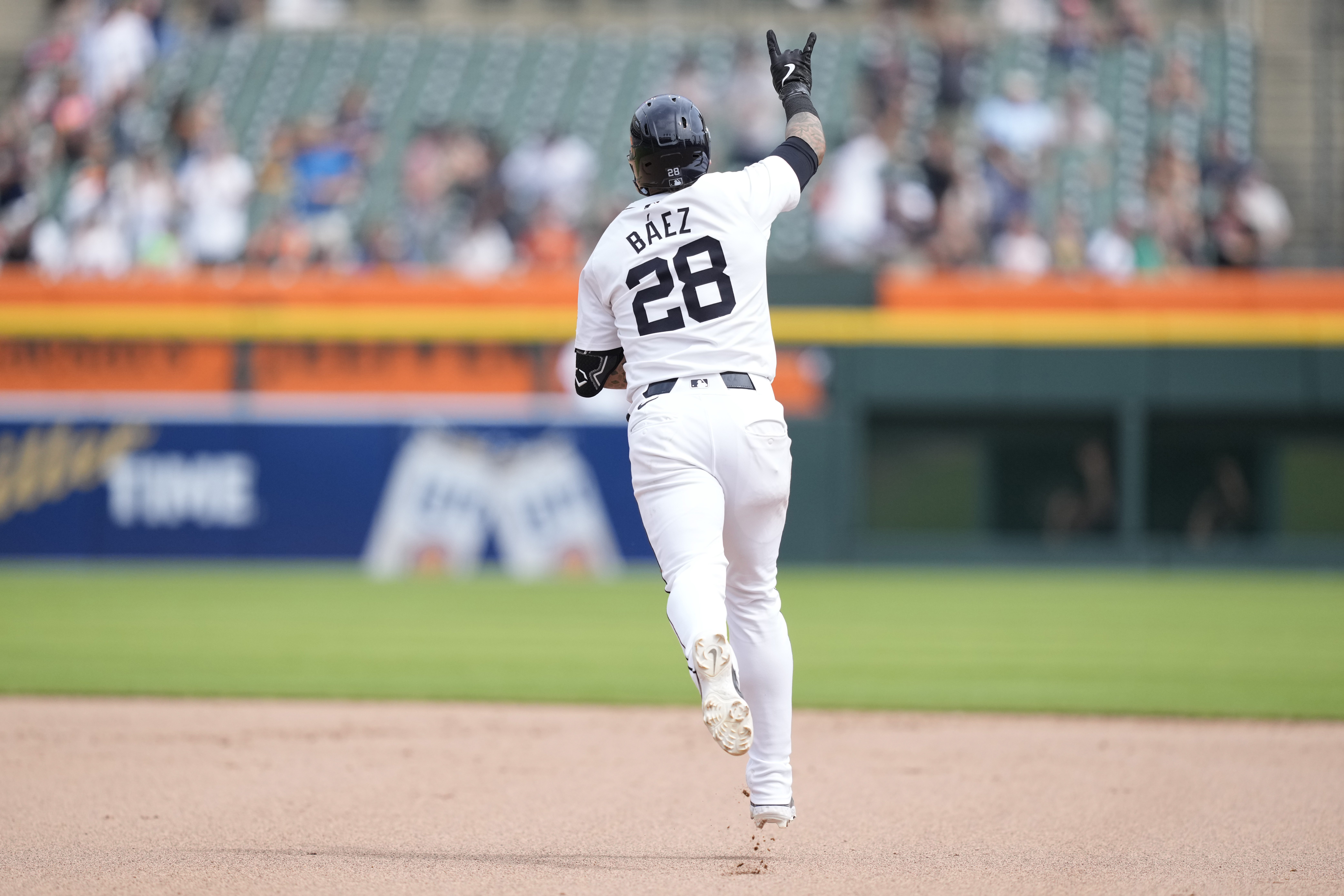 Detroit Tigers' Javier Báez rounds the bases after his two-run home run during the eighth inning of a baseball game against the Seattle Mariners, Thursday, Aug. 15, 2024, in Detroit.