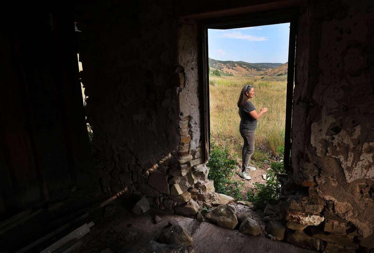 Jess Kirby, director of the County Lands & Natural Resources Department for Summit County, stands by the original Jeremy family homestead on the 910 Cattle Ranch in Summit County on Aug. 9. It was purchased for $55 million and is the largest open-space purchase in Summit County history.