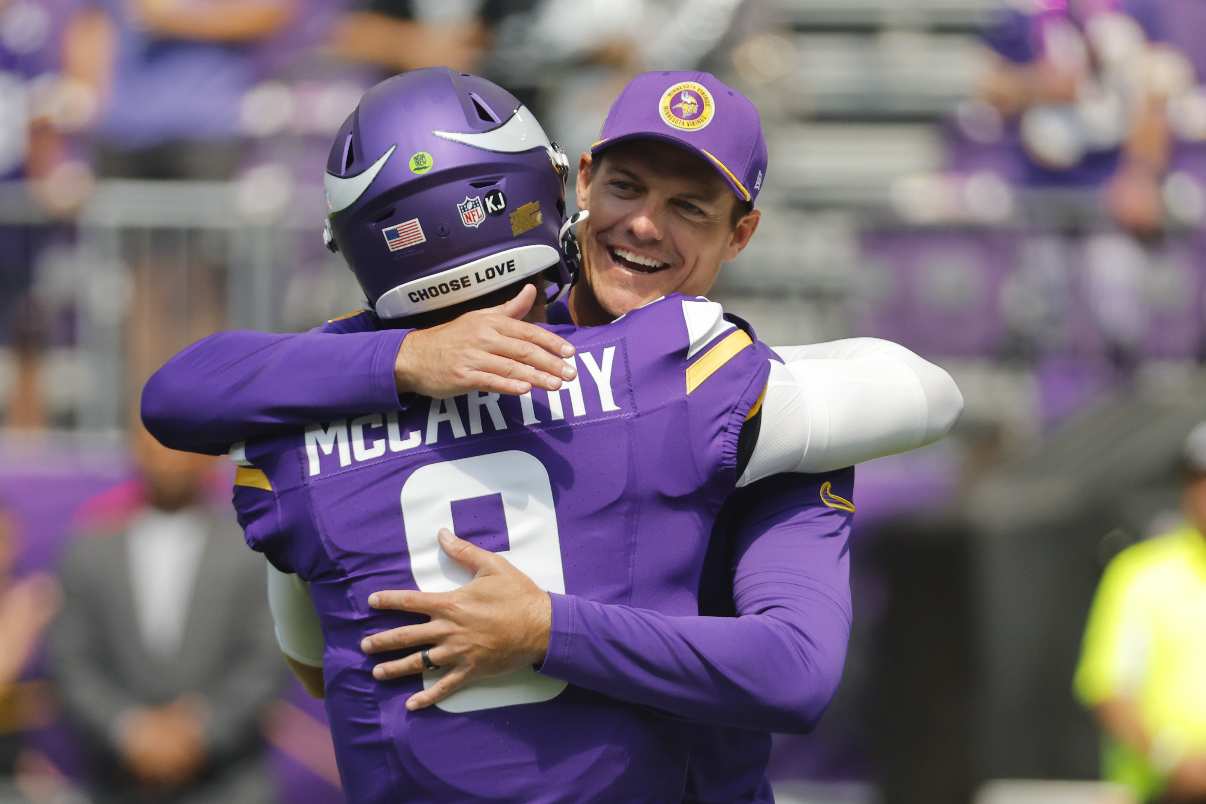 Minnesota Vikings head coach Kevin O'Connell, right, hugs quarterback J.J. McCarthy (9) before an NFL football game against the Las Vegas Raiders, Saturday, Aug. 10, 2024, in Minneapolis. 