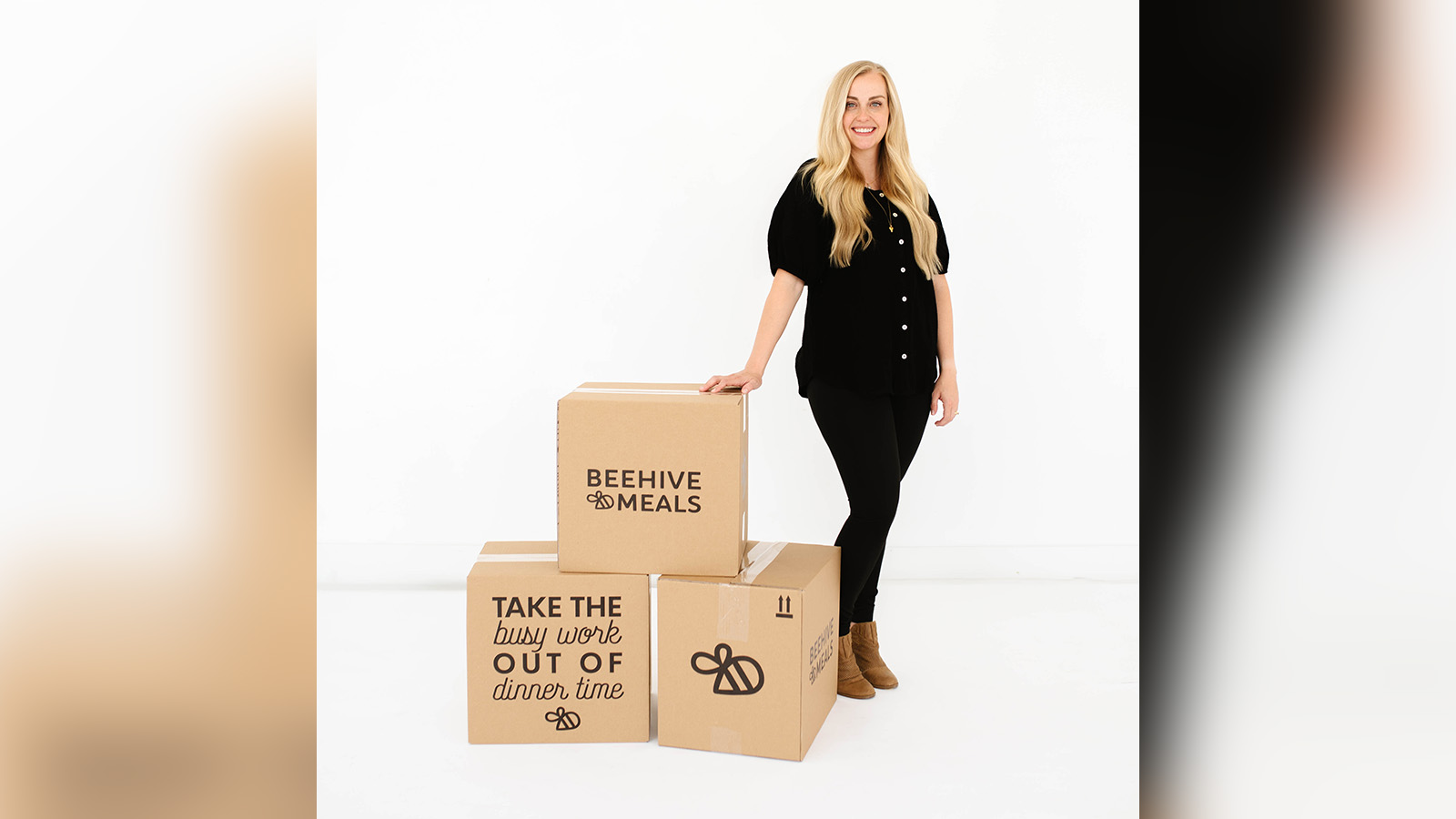 Beehive Meals founder Allyse Jackson poses in front of Beehive Meals boxes. The company on Wednesday took home some serious hardware when the U.S. Department of Commerce announced the company as a top 100 small business in the country.