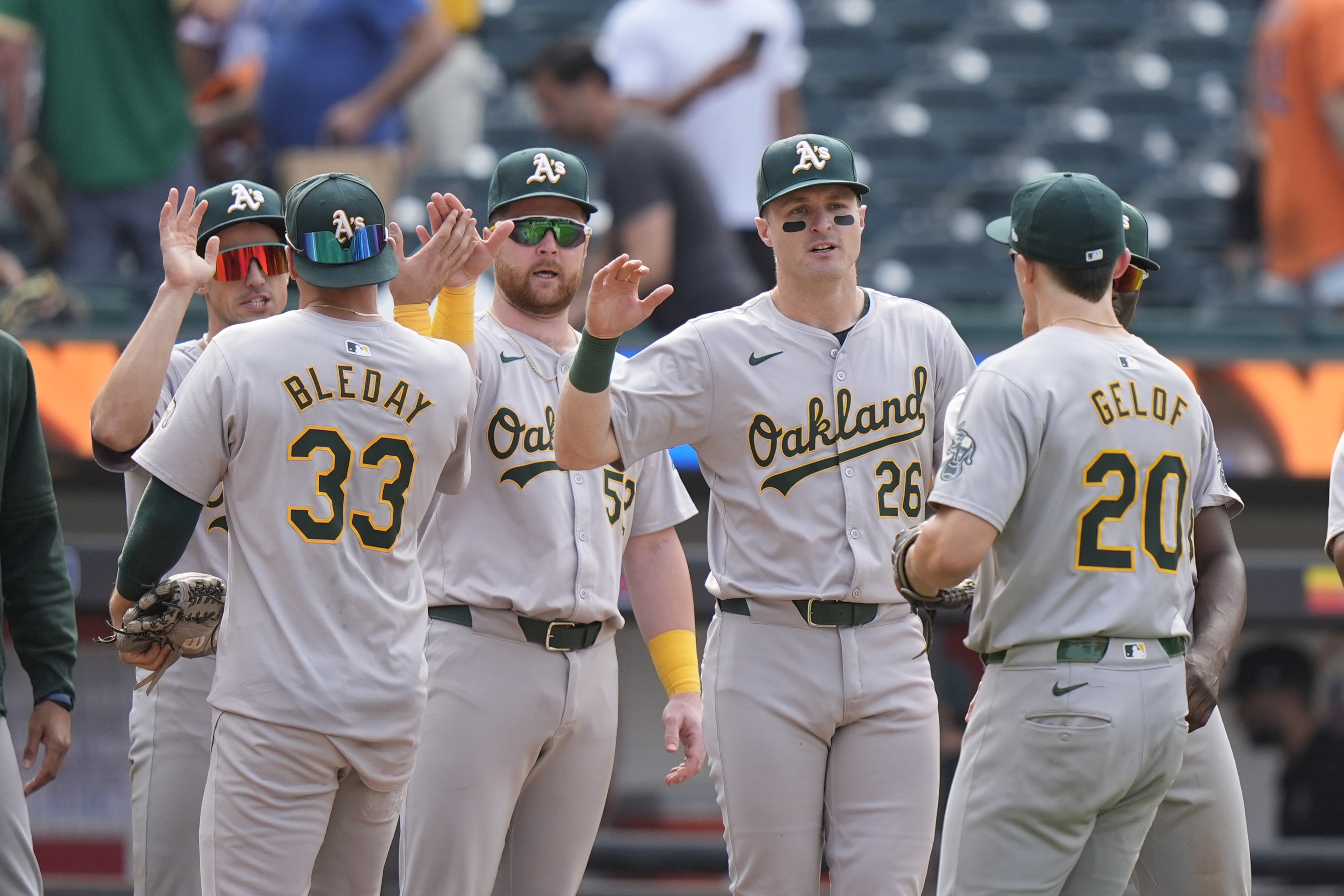 Oakland Athletics' JJ Bleday (33) and Zack Gelof (20) celebrate with teammates after a baseball game against the New York Mets, Thursday, Aug. 15, 2024, in New York. The Athletics won 7-6. 