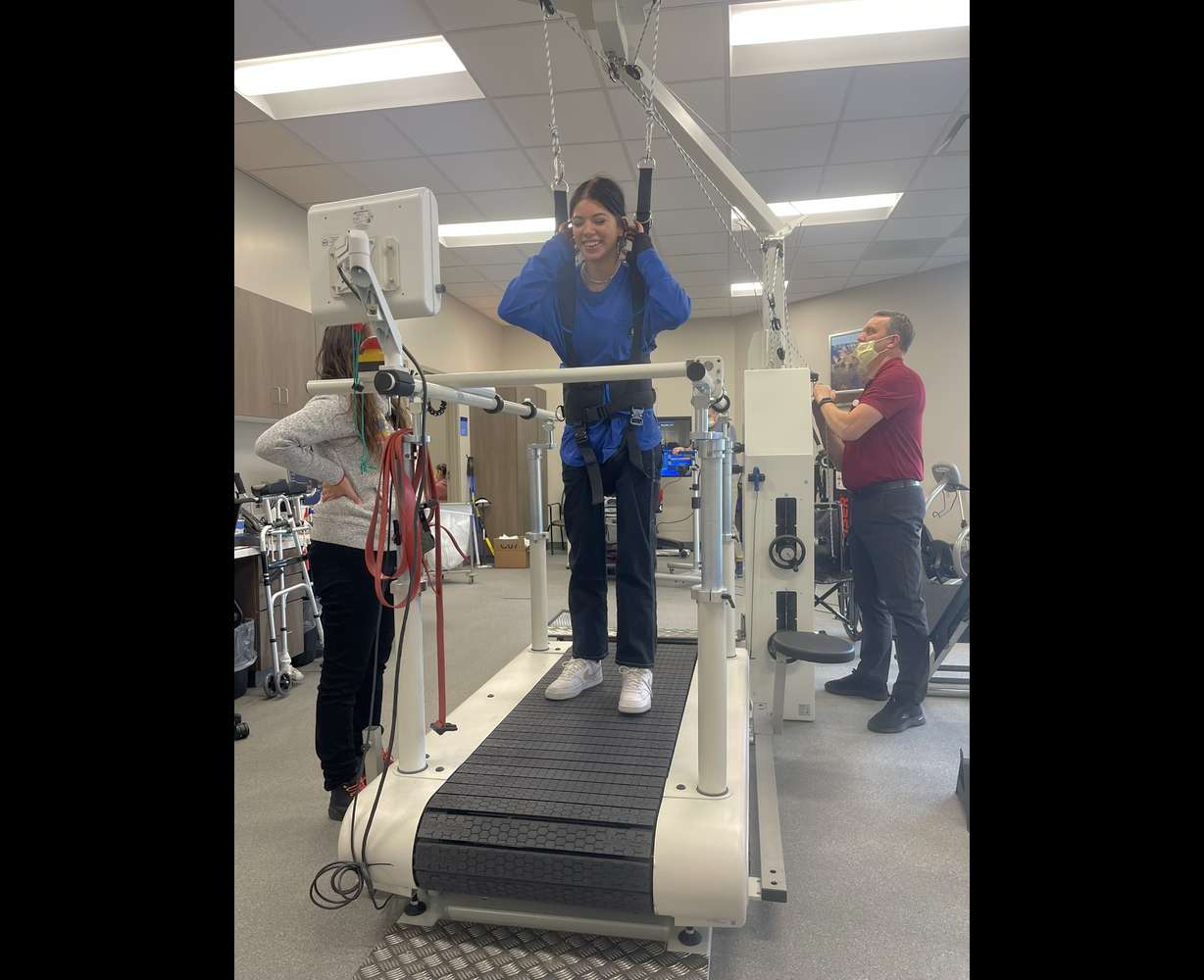 Madison Gill works on her physical therapy with Tyson Winder in this undated photo.