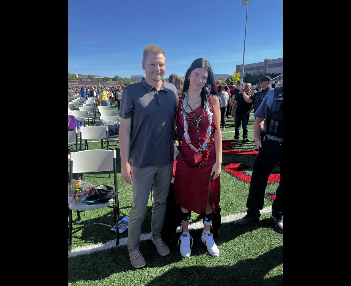 Madison Gill celebrates her graduation in May 2024, with her physical therapist, Tyson Winder.