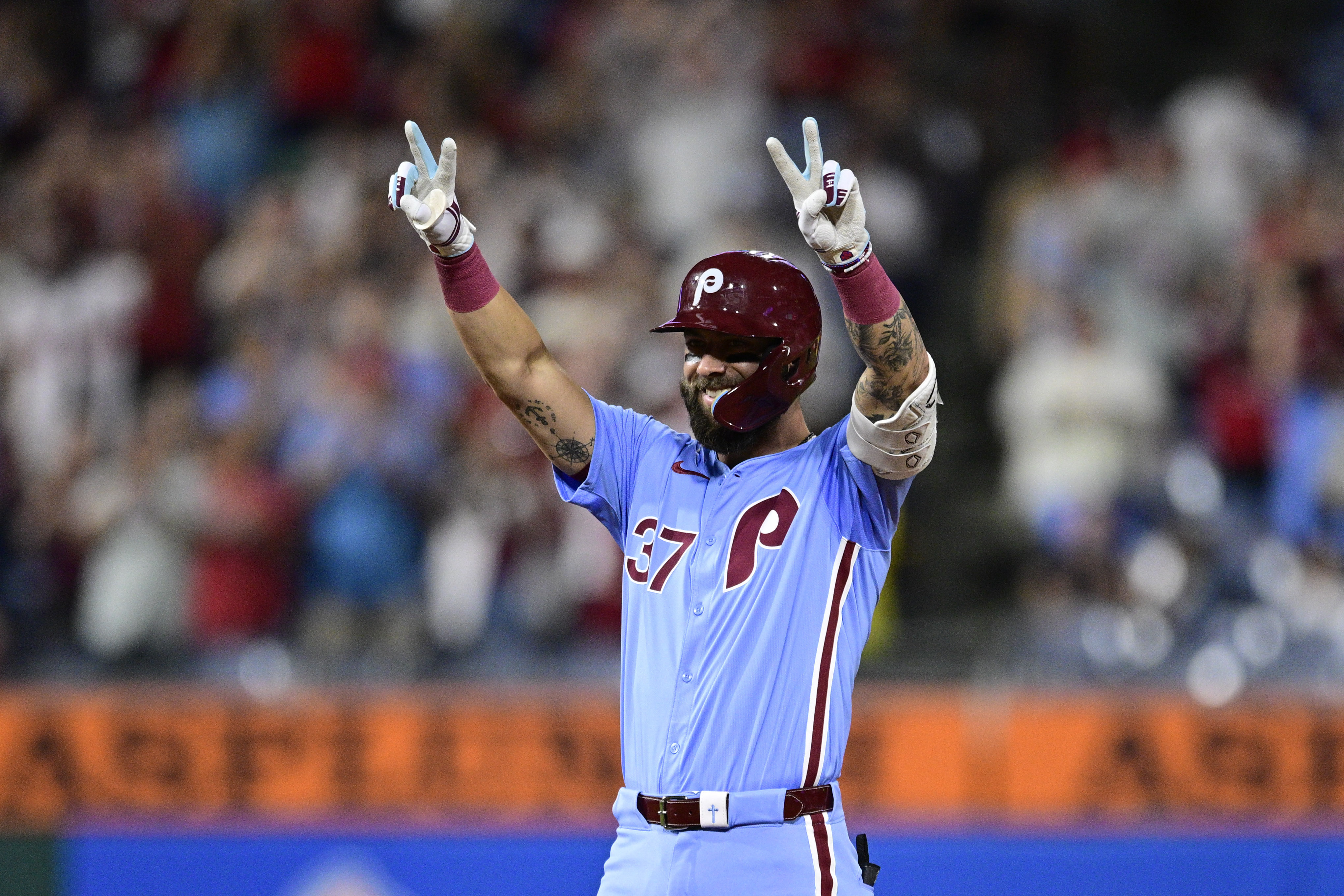 Philadelphia Phillies' Weston Wilson reacts after hitting a double off Washington Nationals' Orlando Ribalta during the eighth inning of a baseball game, Thursday, Aug. 15, 2024, in Philadelphia. 