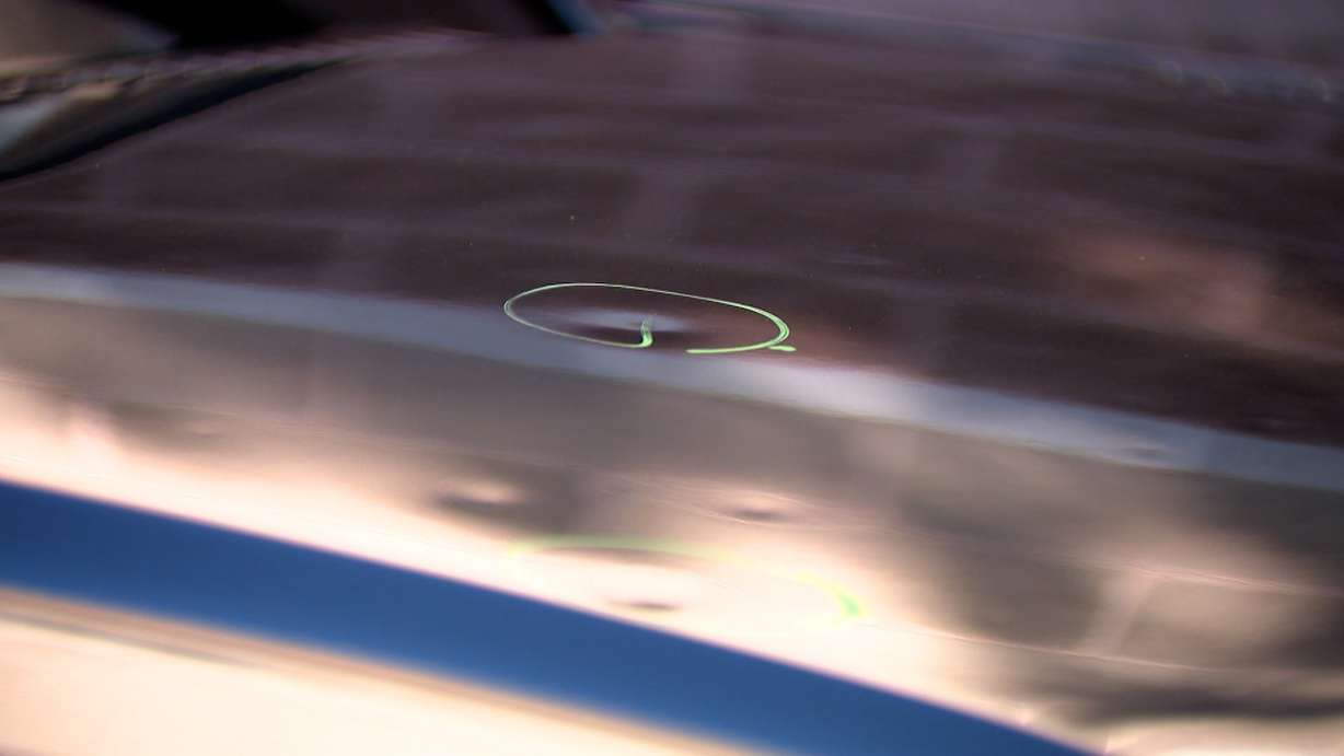 Marked damage is shown on a Utah County car Thursday after a large hail storm that happened Tuesday.