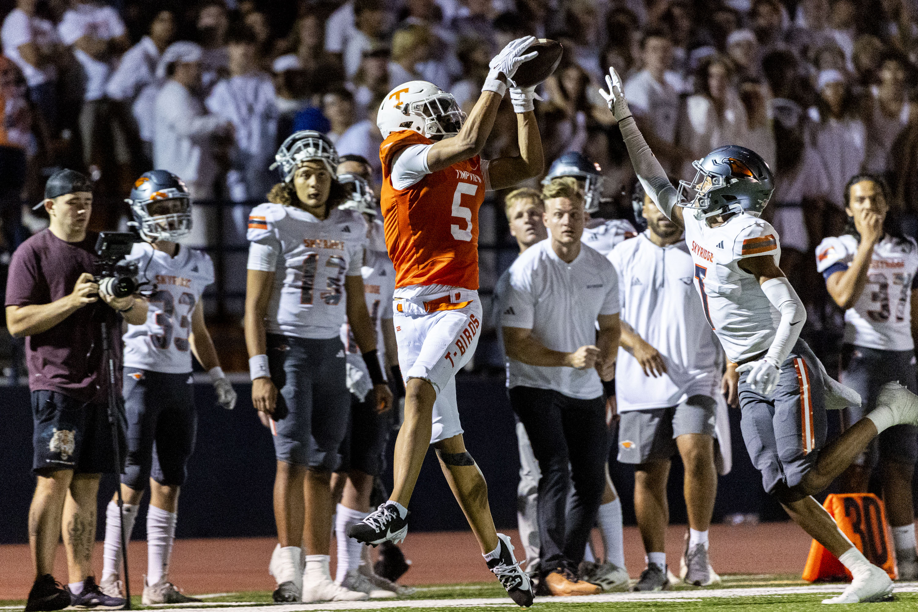 Timpview wide receiver Jaron Pula (5) completes a catch while guarded by Skyridge defensive back Jaxon Burt (7) during a game held at Timpview High School in Provo on Thursday, Aug. 15, 2024.
