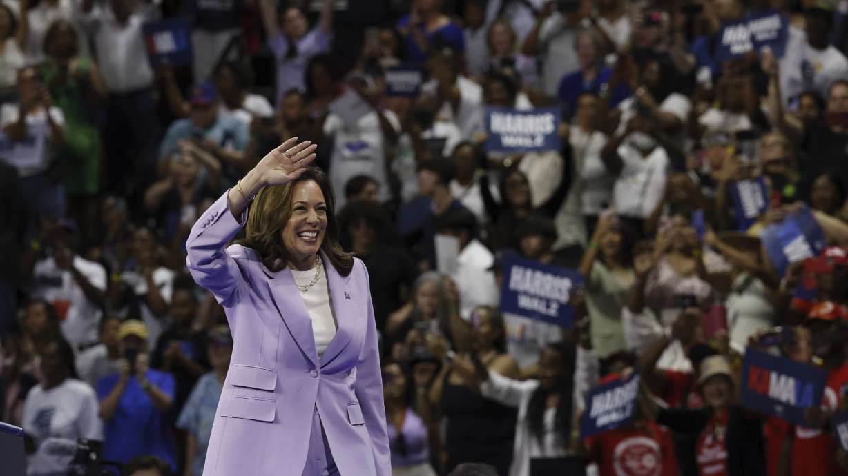 Vice President Kamala Harris and Governor Tim Waltz host a campaign rally in Las Vegas, on Aug. 10. A Harris advertising campaign that uses Google search is prompting some concerns among news outlets.