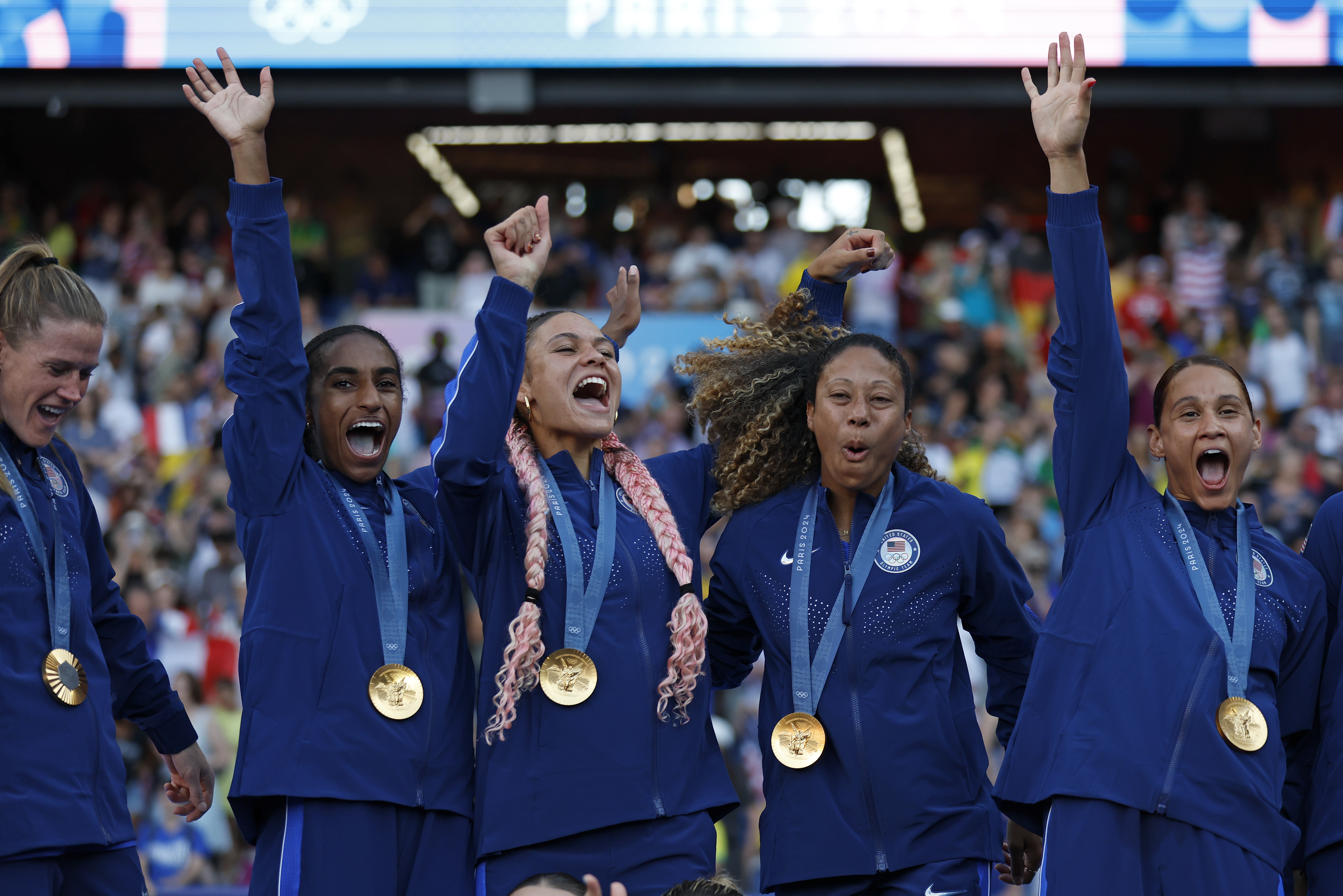 The United States team players celebrate with their gold medals during the medal ceremony after the women's soccer gold medal match between Brazil and the United States at the Parc des Princes during the 2024 Summer Olympics, Saturday, Aug. 10, 2024, in Paris, France. 