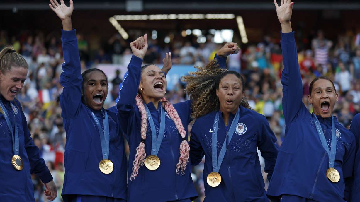 The United States team players celebrate with their gold medals during the medal ceremony after the women's soccer gold medal match between Brazil and the United States at the Parc des Princes during the 2024 Summer Olympics, Saturday, Aug. 10, 2024, in Paris, France.