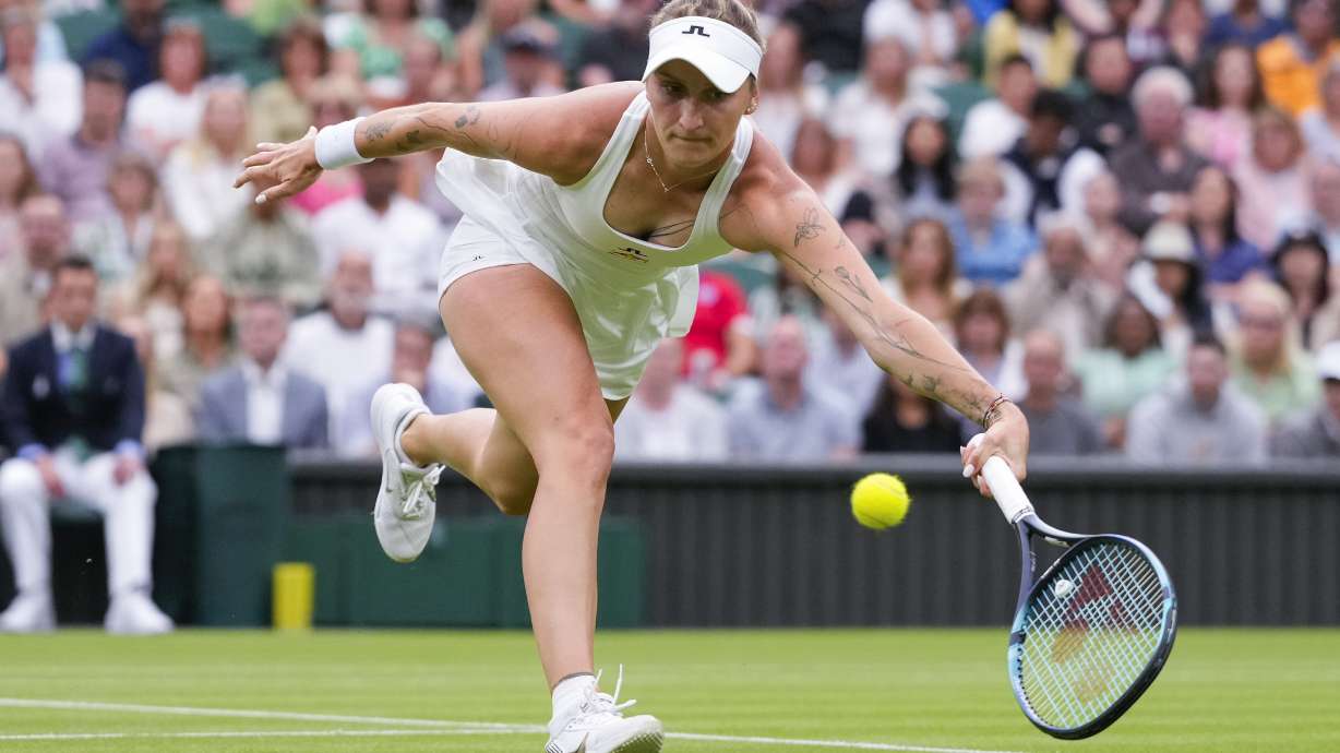 FILE - Marketa Vondrousova of the Czech Republic plays a forehand return to Jessica Bouzas Maneiro of Spain during their first round match at the Wimbledon tennis championships in London, July 2, 2024.