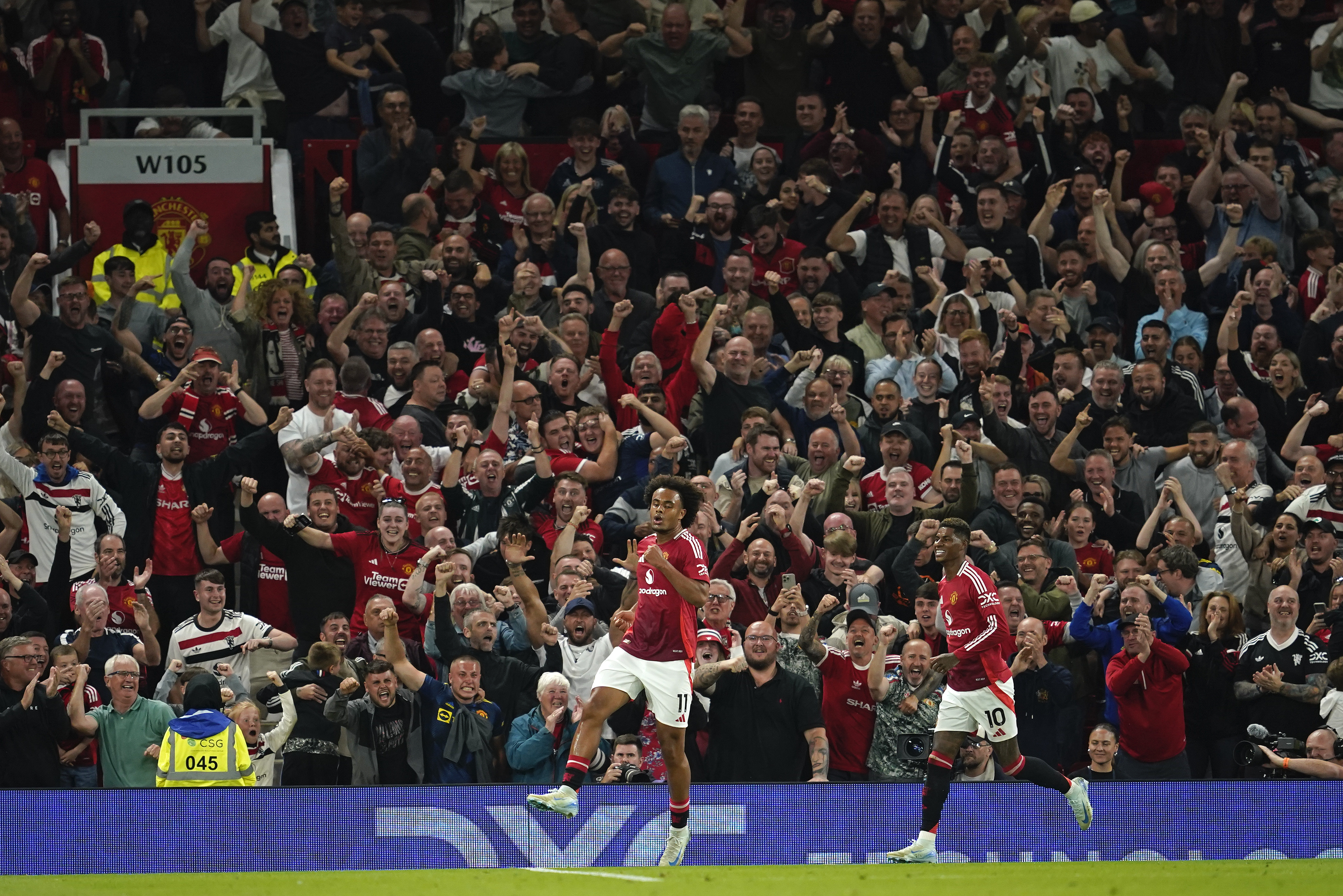 Manchester United's Joshua Zirkzee celebrates after scoring the opening goal during the English Premier League soccer match between Manchester United and Fulham at Old Trafford, Friday, Aug. 16, 2024, in Manchester, England.