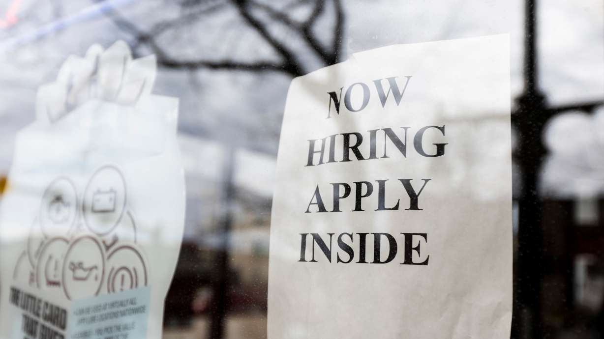 A hiring sign is seen in a Jiffy Lube window in Salt Lake City on Feb. 9. Utah's year-over-year job growth in July exceeded the 2% it has consistently hovered around since last June, clocking in at 2.8% across the past 12 months.