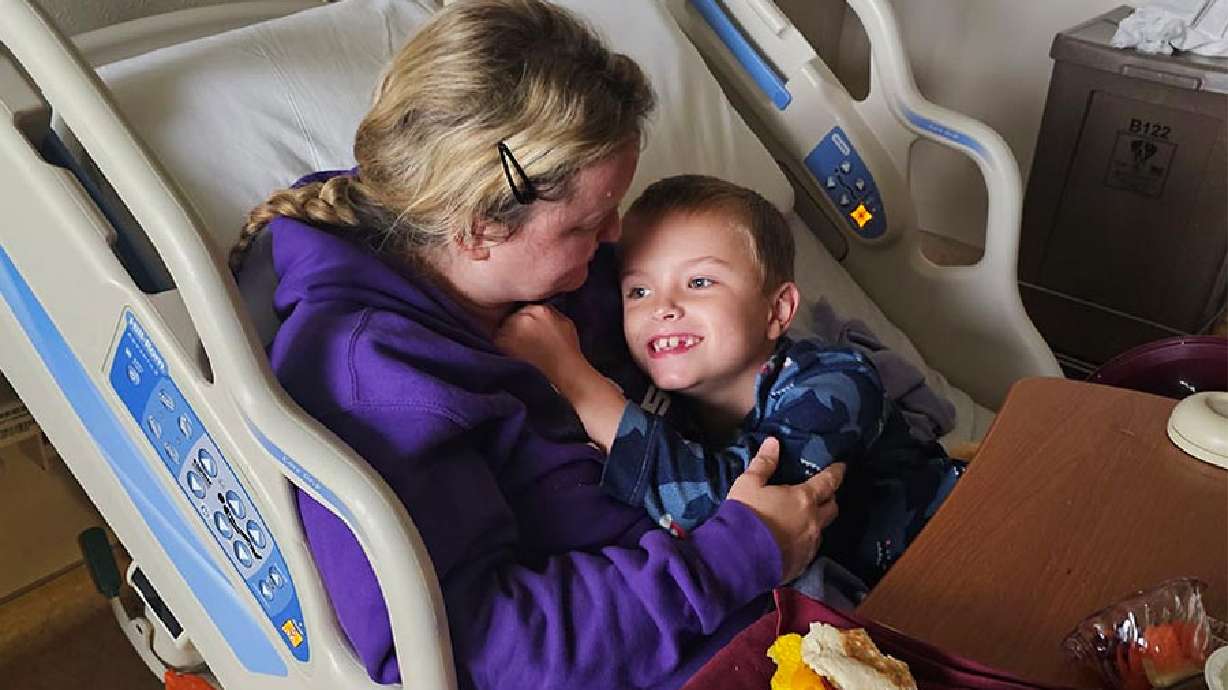 Ethan Young recovers in the hospital while being held by Crystal Young in this undated photo. Ethan miraculously survived a drowning accident in Idaho.