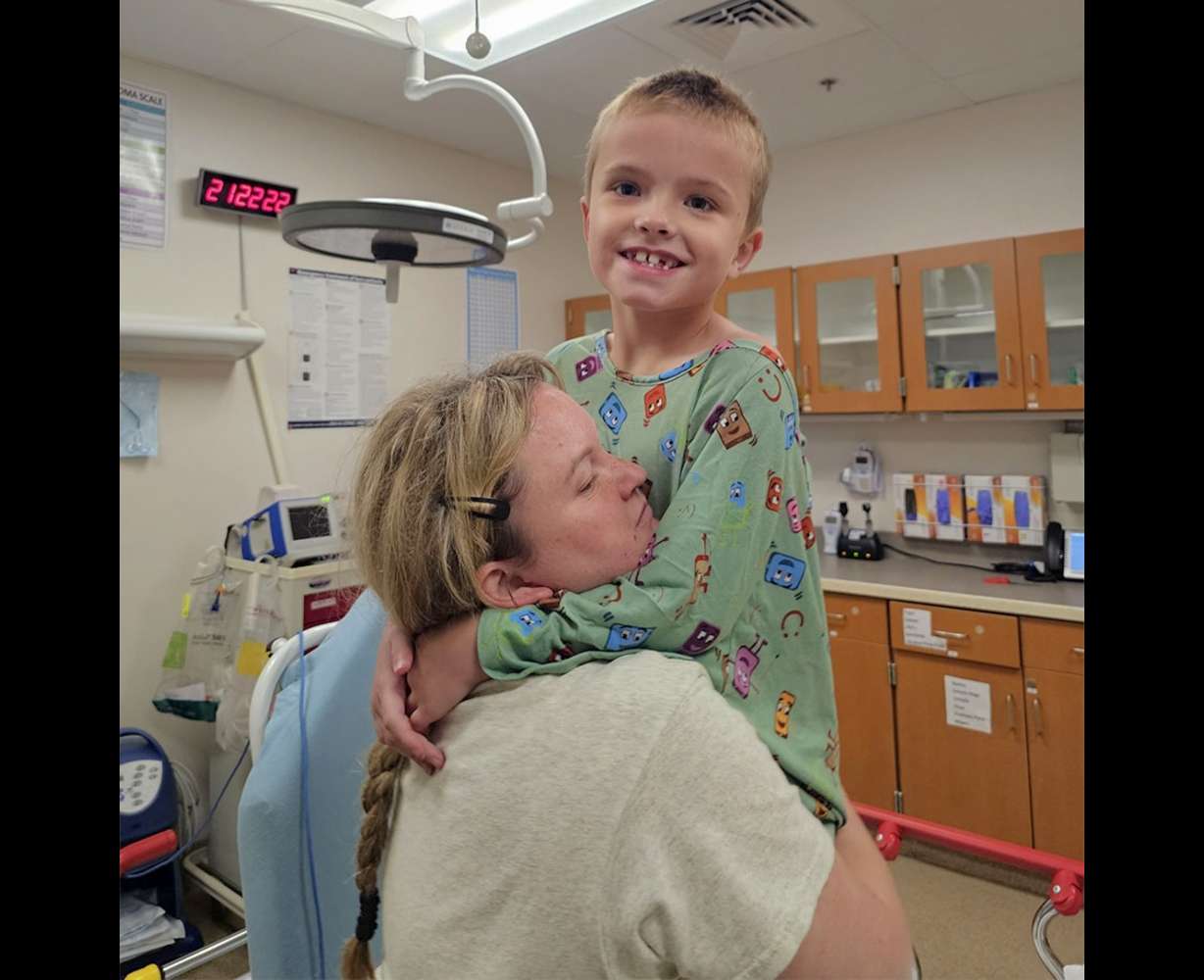 Ethan Young is held by Crystal Young about an hour after the accident at the Palisades Reservoir in Idaho on Aug. 5.