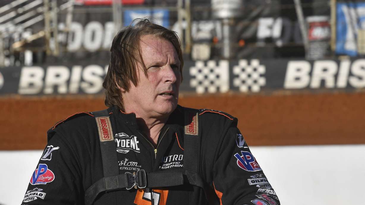 Scott Bloomquist stands beside his car before the Super Late Model division race at the Karl Kustoms Bristol Dirt Nationals, April 1, 2022, at Bristol Motor Speedway in Bristol, Tenn.