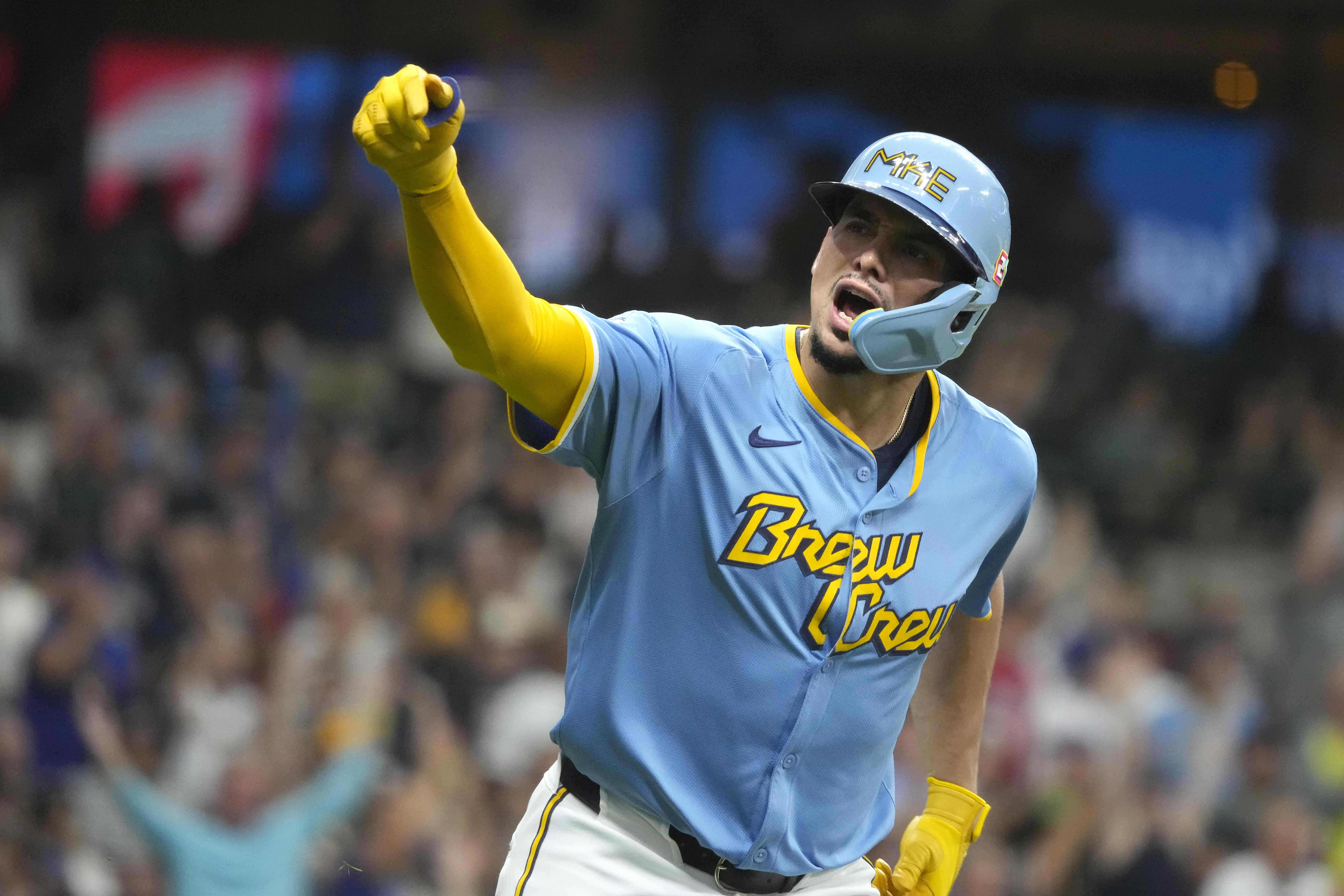 Milwaukee Brewers' Willy Adames (27) reacts to hitting a three-run home run during the first inning of a baseball game against the Cleveland Guardians, Friday, Aug. 16, 2024, in Milwaukee. 